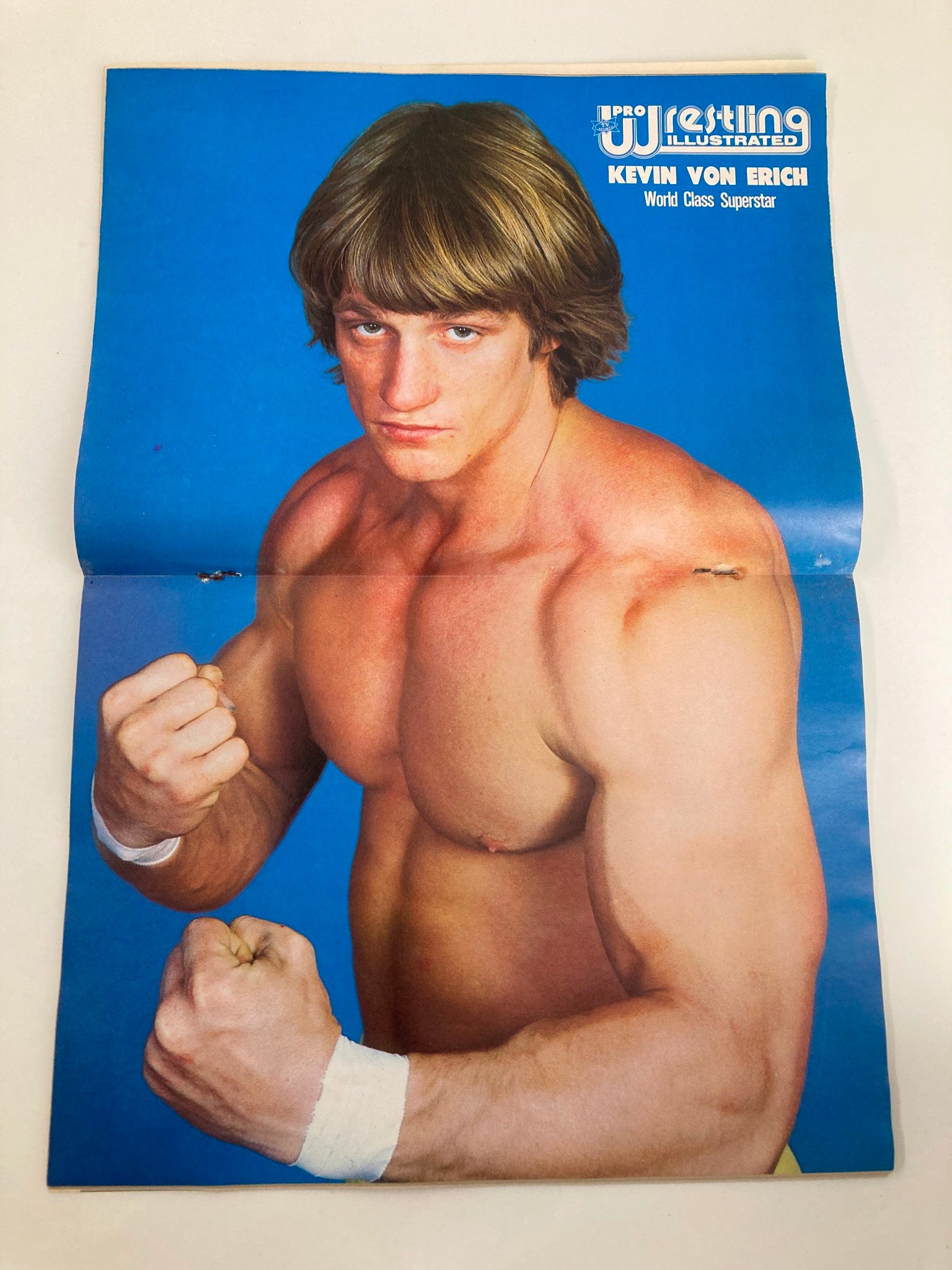 Pro Wrestling Illustrated magazine featuring Kevin Von Erich on the cover, showcasing him as a World Class Superstar with a vibrant blue background.