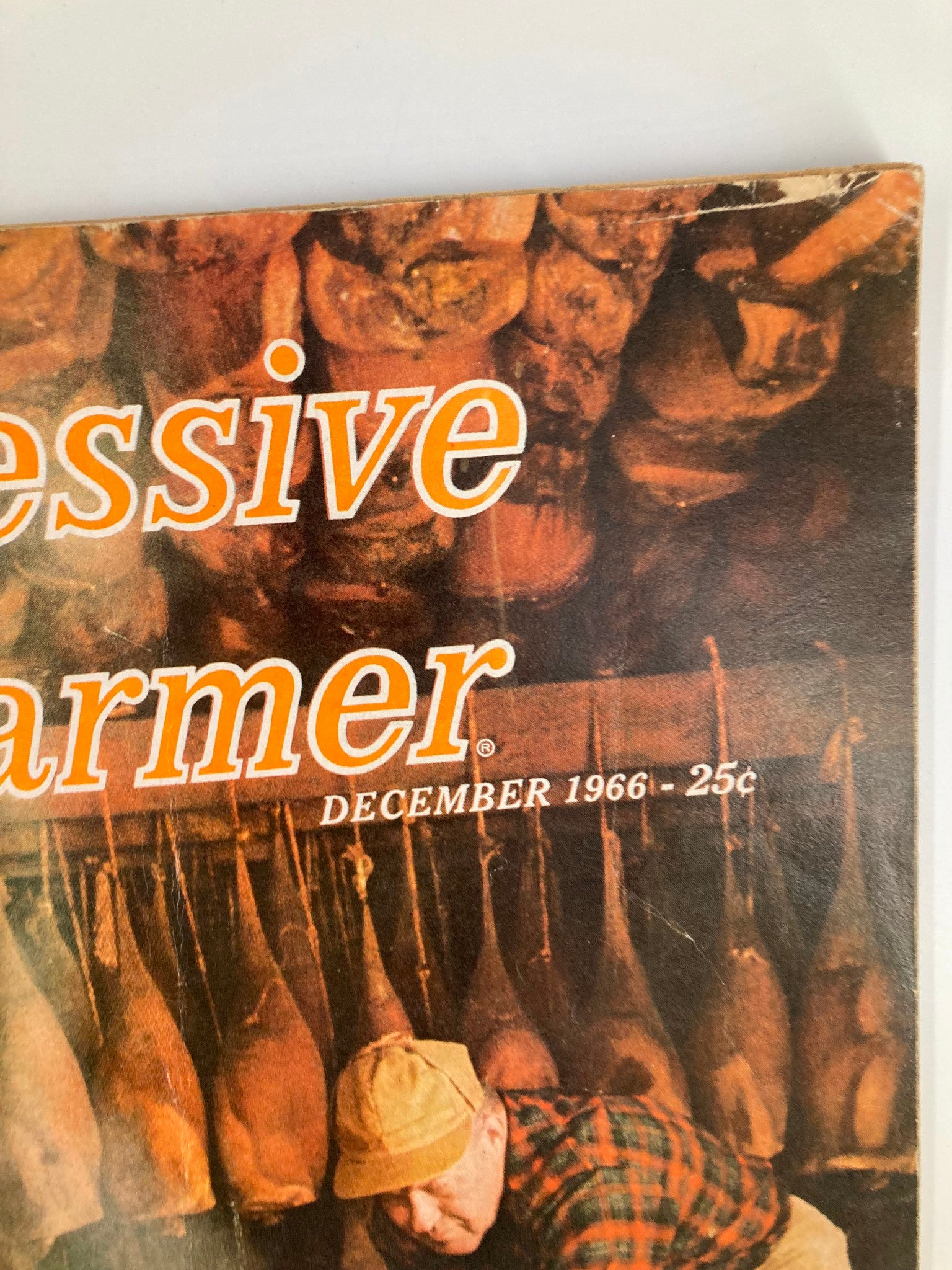 Close-up of VTG The Progressive Farmer Magazine December 1966 title, highlighting 'Progressive Farmer' and the date under the image of hams in a storeroom.