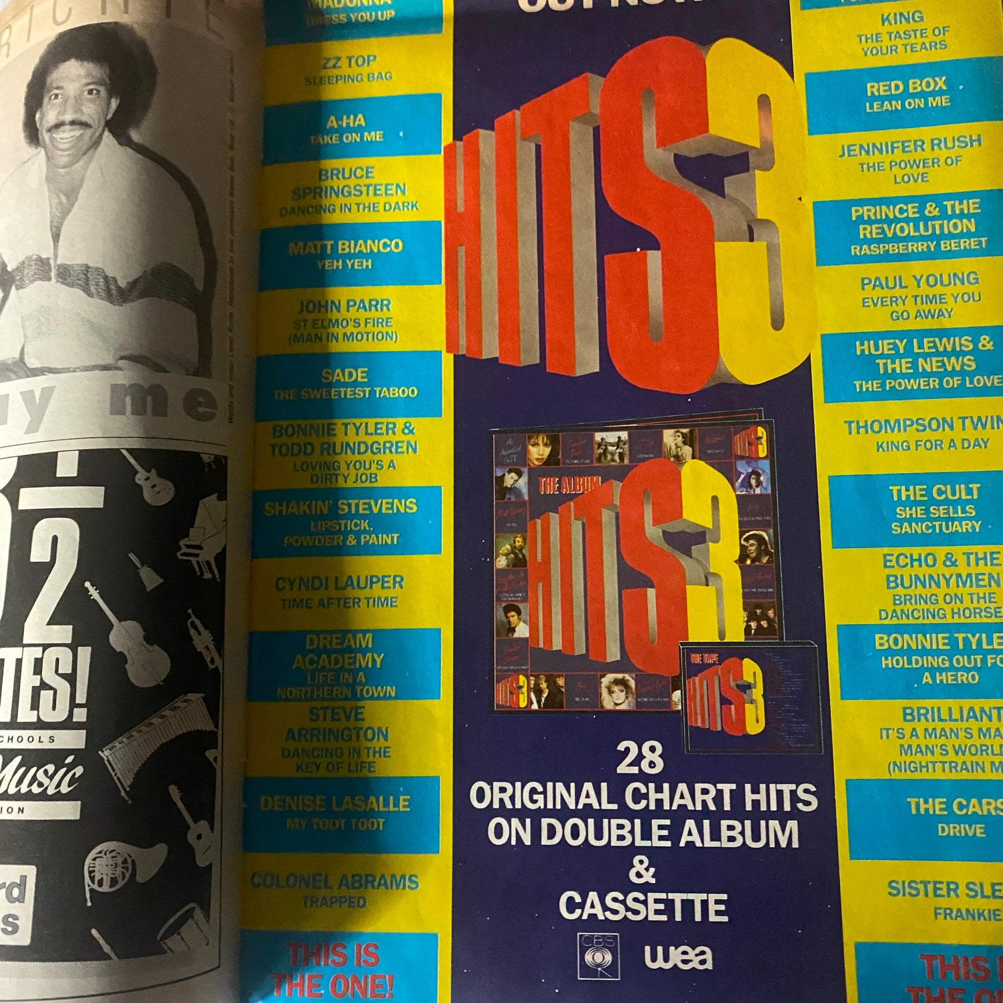 Interior page from VTG No. 1 Magazine November 30, 1985 showing various music hits including songs by Bruce Springsteen and Cyndi Lauper.