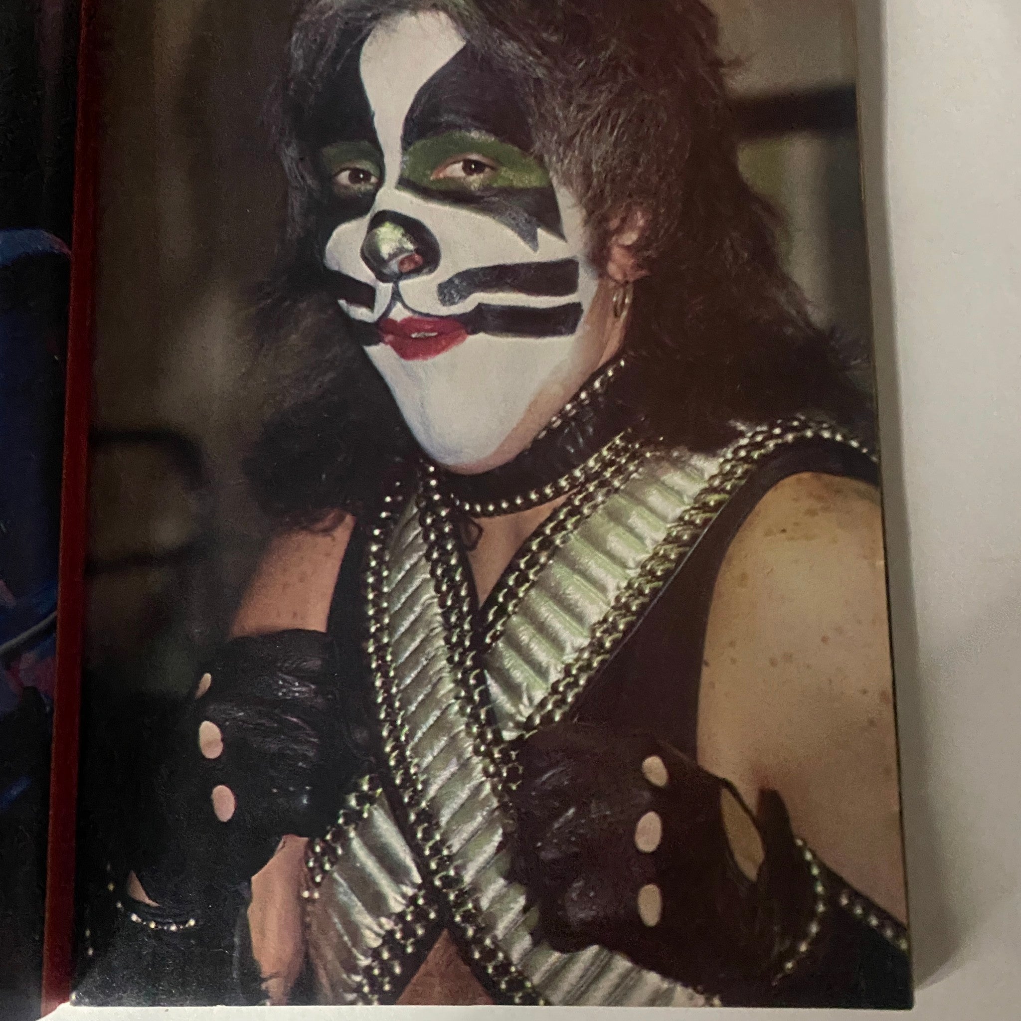 Kiss band member in full stage makeup and costume, showcasing their iconic look for 'New Wave Rock Presents Supergroups' November 1978, representing the vibrant 70s music scene.
