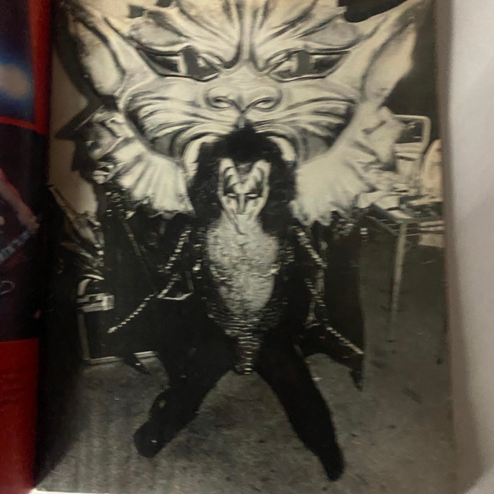 A dramatic stage image of a Kiss band member in a striking costume against a large mythical backdrop, featured in 'New Wave Rock Presents Supergroups' November 1978.
