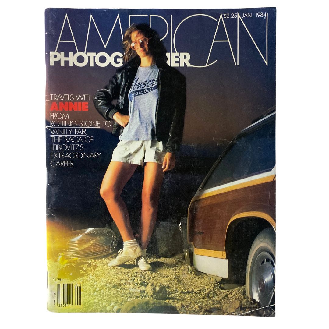 Cover of the January 1984 American Photographer Magazine featuring Annie Leibovitz. The cover showcases an iconic photograph of Annie in casual attire, standing outdoors against a sunset backdrop.