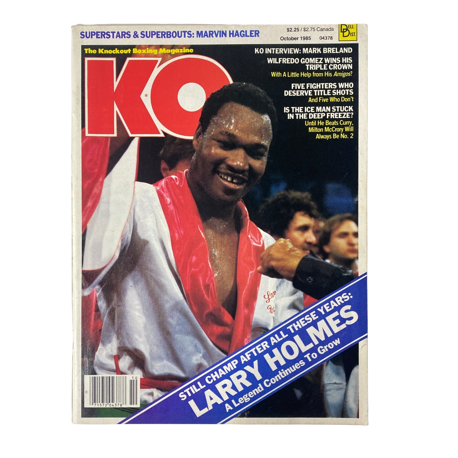 Cover of KO Boxing Magazine October 1985 featuring Larry Holmes, showcasing a victorious moment and the headline ‘Still Champ After All These Years: A Legend Continues to Grow’.