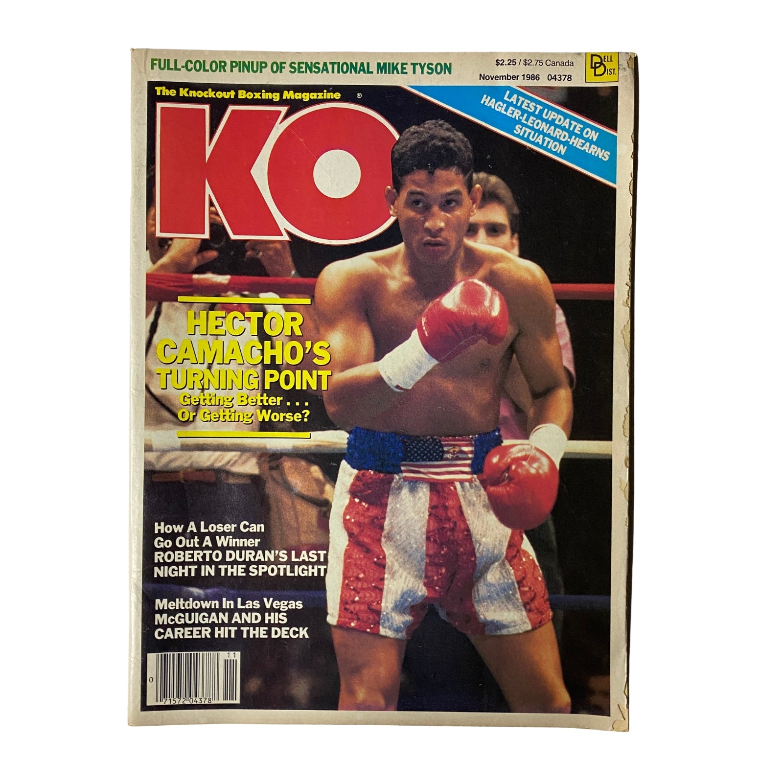 KO Boxing Magazine November 1986 featuring Hector Camacho on the cover, showcasing him in boxing shorts with an American flag design. The magazine highlights significant topics in boxing history including Camacho's influence.
