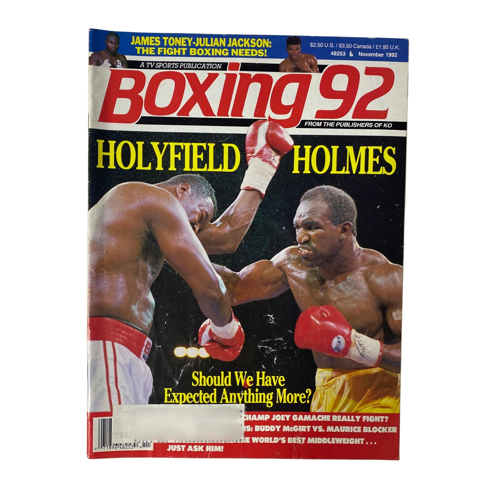 Cover of Boxing 92 Magazine, November 1992 featuring Evander Holyfield and Larry Holmes. The headline reads 'Should We Have Expected Anything More?' with a focus on their heavyweight clash.