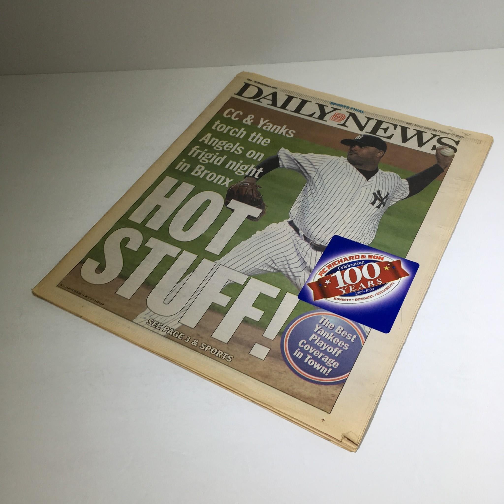 Cover of NY Daily News from 10/17/2009 featuring headline 'CC & Yanks Torch the Angels on Frigid Night in Bronx'. The image showcases a baseball player in a Yankees uniform, emphasizing sports coverage and excitement around the game.
