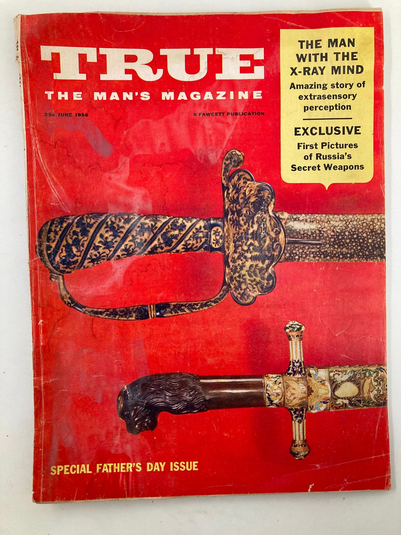 Cover of TRUE The Man's Magazine from June 1956 featuring the title 'The Man with the X-Ray Mind', showcasing a detailed illustration of ornate swords on a striking red background, noted for its special Father's Day issue.
