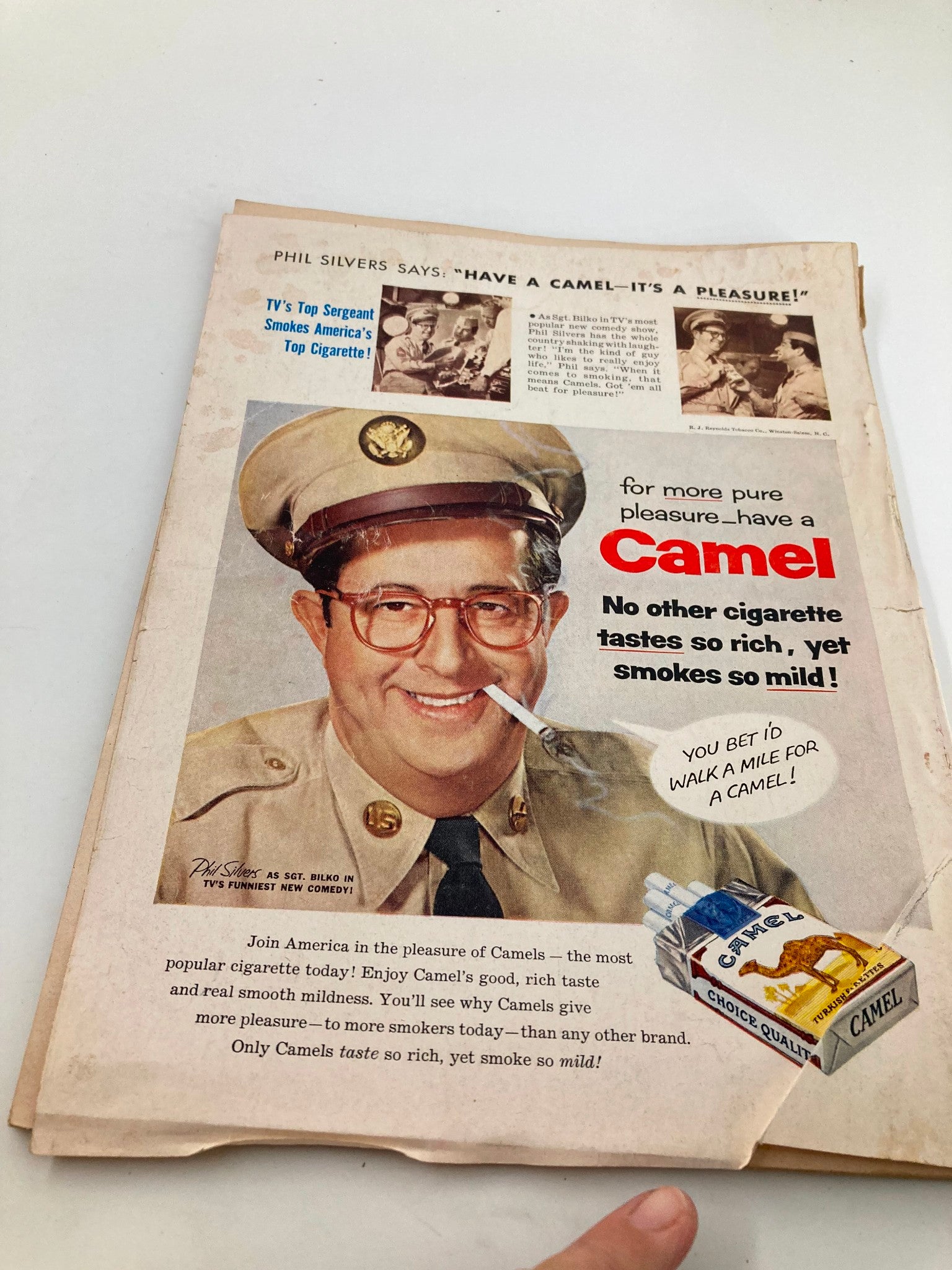 Advertisement page from TRUE The Man's Magazine June 1956 featuring Phil Silvers promoting Camel cigarettes, highlighting the claim of rich taste and smoothness.