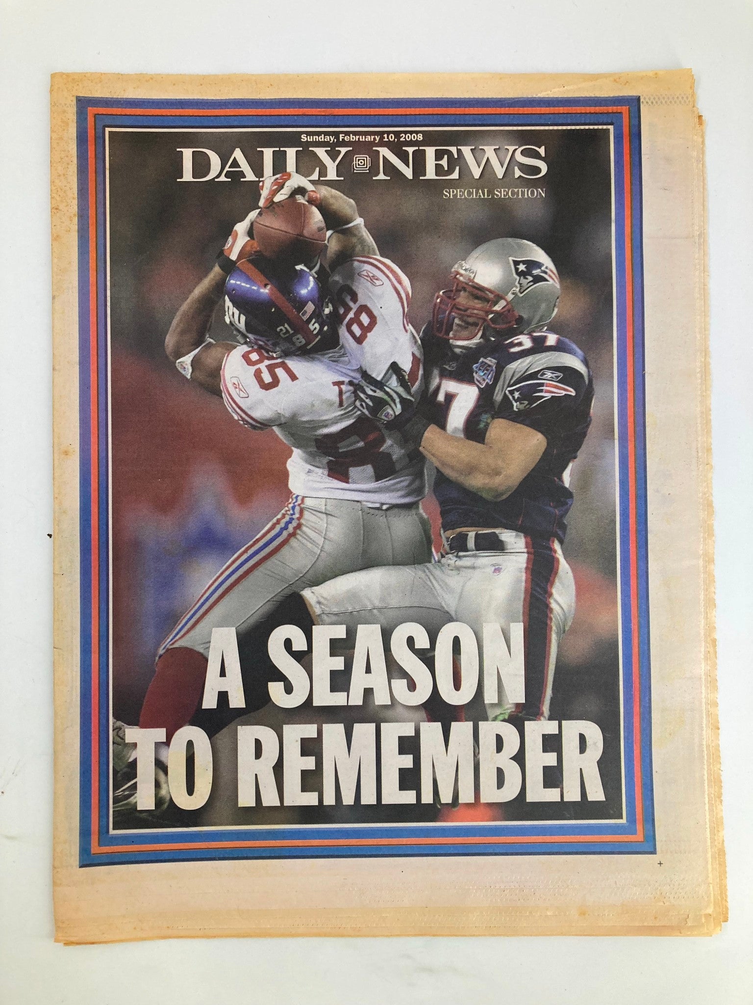 Daily News newspaper cover from February 10, 2008, featuring the headline 'A Season To Remember', showcasing a memorable sports moment with two players in action.