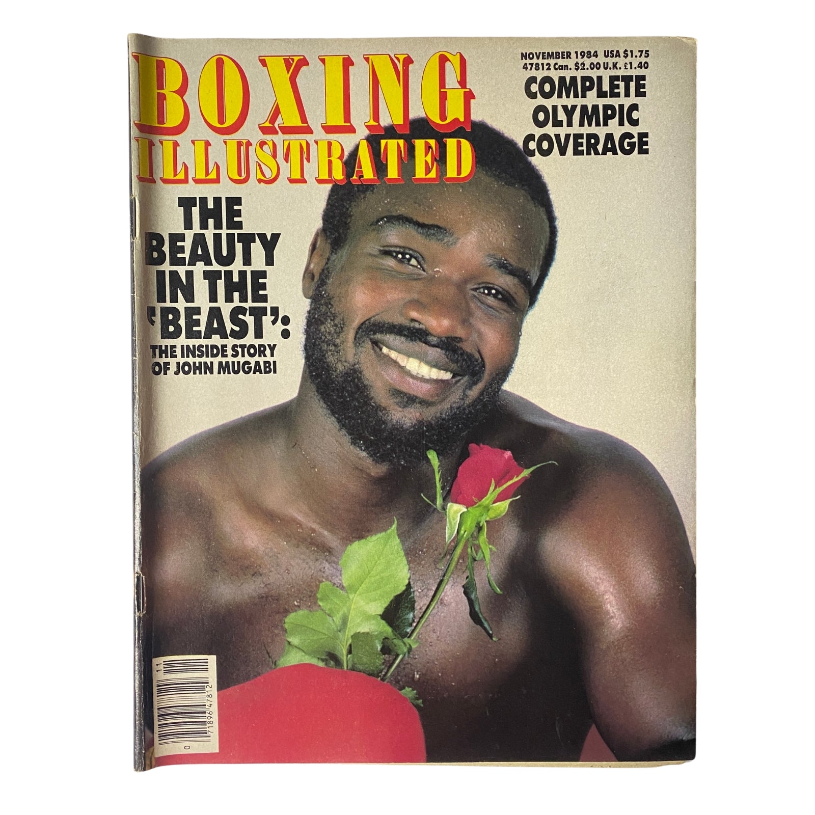 Boxing Illustrated Magazine November 1984 cover featuring John Mugabi, known as 'The Beast', showcasing a striking portrait with a rose, highlighting the feature 'The Beauty in the Beast'.