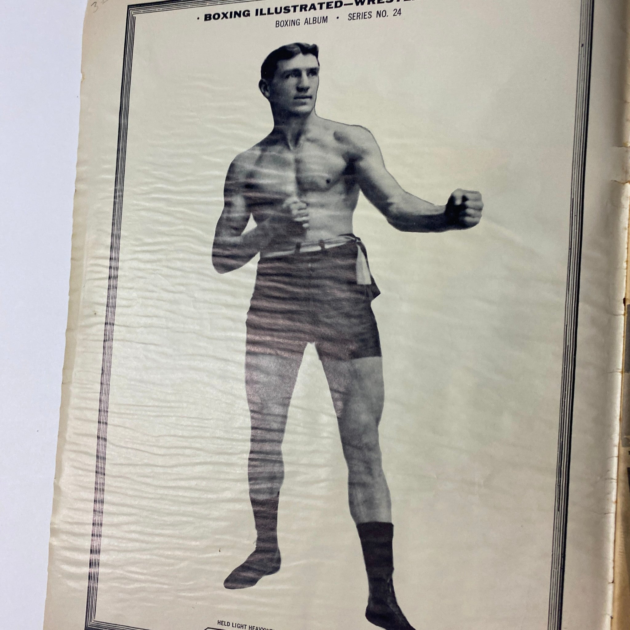 Historical black and white photo from Boxing Illustrated Magazine featuring an unnamed boxer in shorts, highlighting the boxing album section from the September 1961 issue.