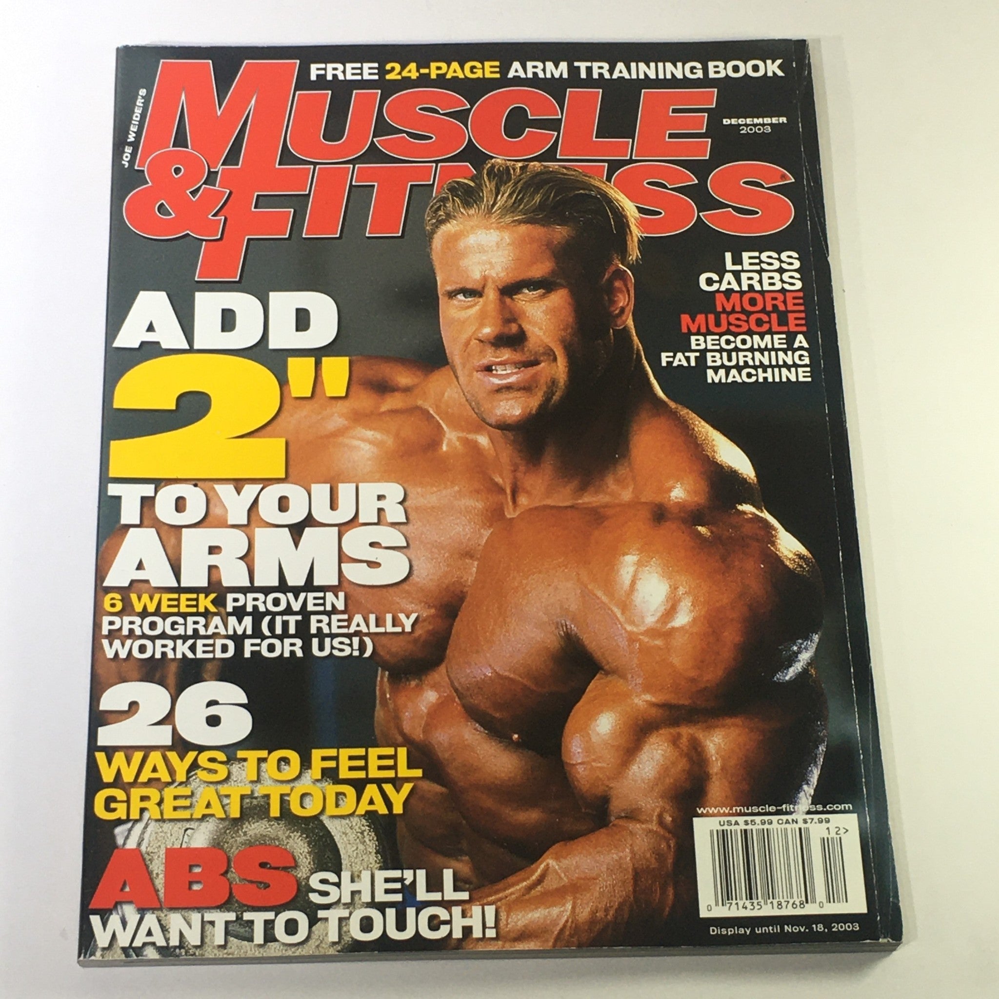 Cover of Muscle & Fitness Magazine, December 2003, featuring Jay Cutler with the title 'Less Carbs, More Muscle'. This vintage issue highlights Cutler's insights on nutrition and muscle mass, perfect for fitness enthusiasts and collectors.