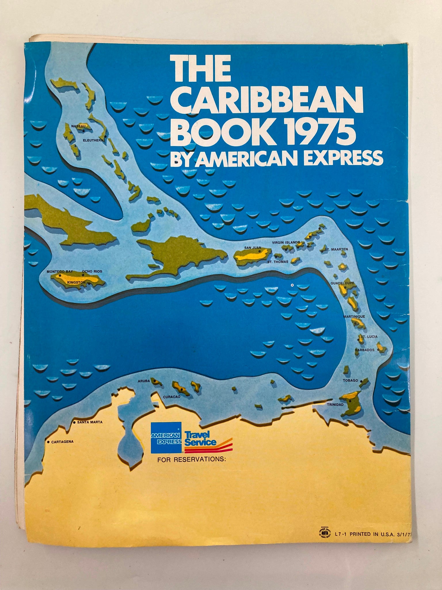 Map page from The Caribbean Book 1975 by American Express, highlighting the Caribbean region with artistic details for travel planning.