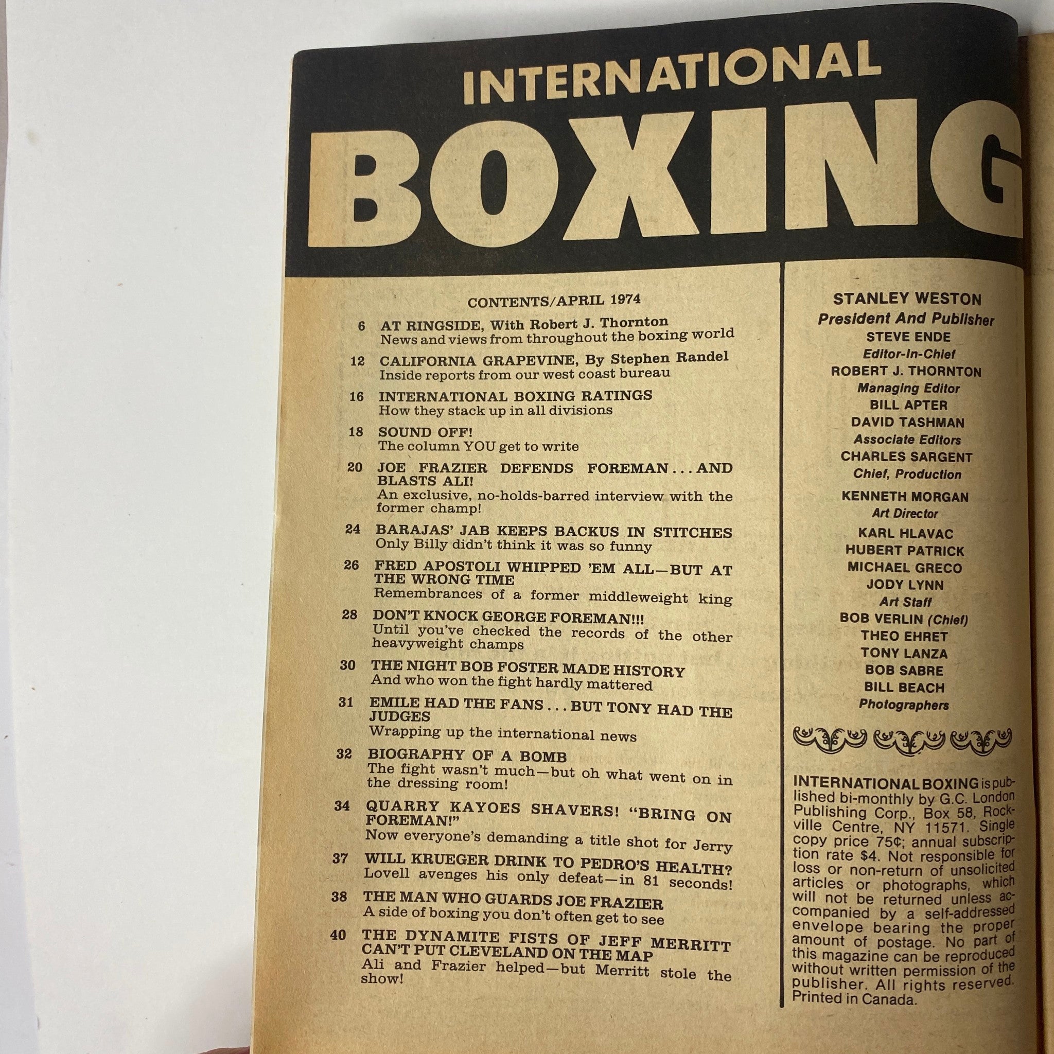 Table of contents from International Boxing Magazine April 1974 featuring Jerry Quarry and George Foreman on the cover. Highlights various boxing articles and features, emphasizing the dramatic heavyweight division events of that time.