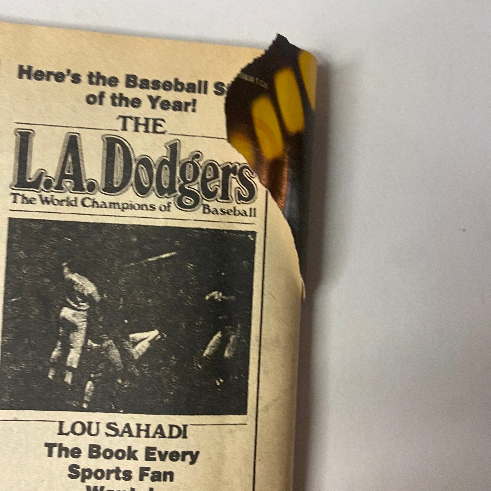 Close-up of the back cover of Boxing Scene Magazine June 1986 showcasing an advertisement for L.A. Dodgers, emphasizing the book 'Lou Sahadi, The Book Every Sports Fan Wants'.