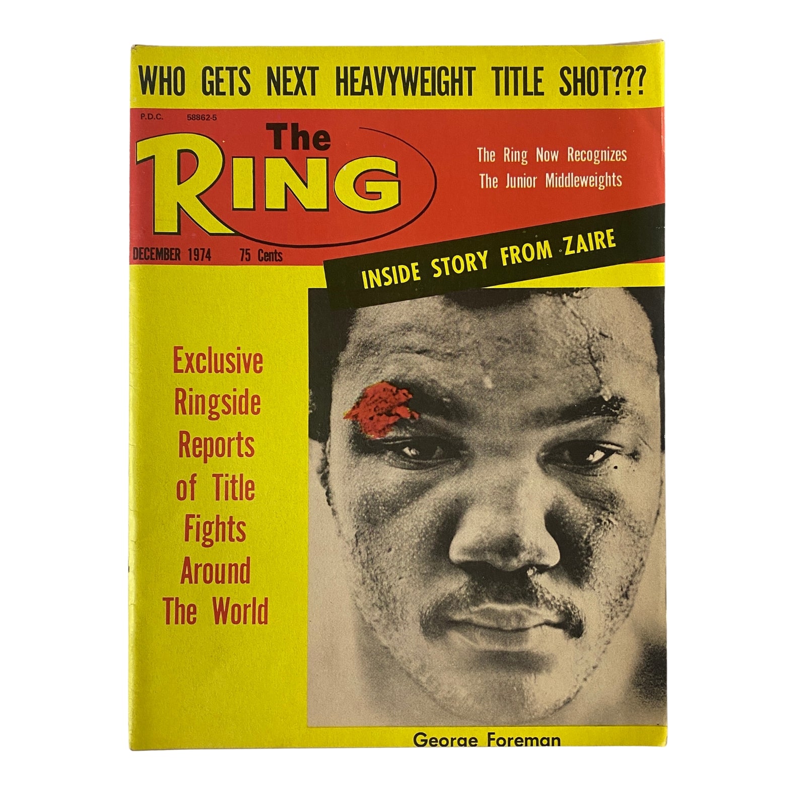 The Ring Magazine December 1974 featuring George Foreman on the cover. The cover highlights an exclusive ringside report from Zaire and queries on the next heavyweight title contender.
