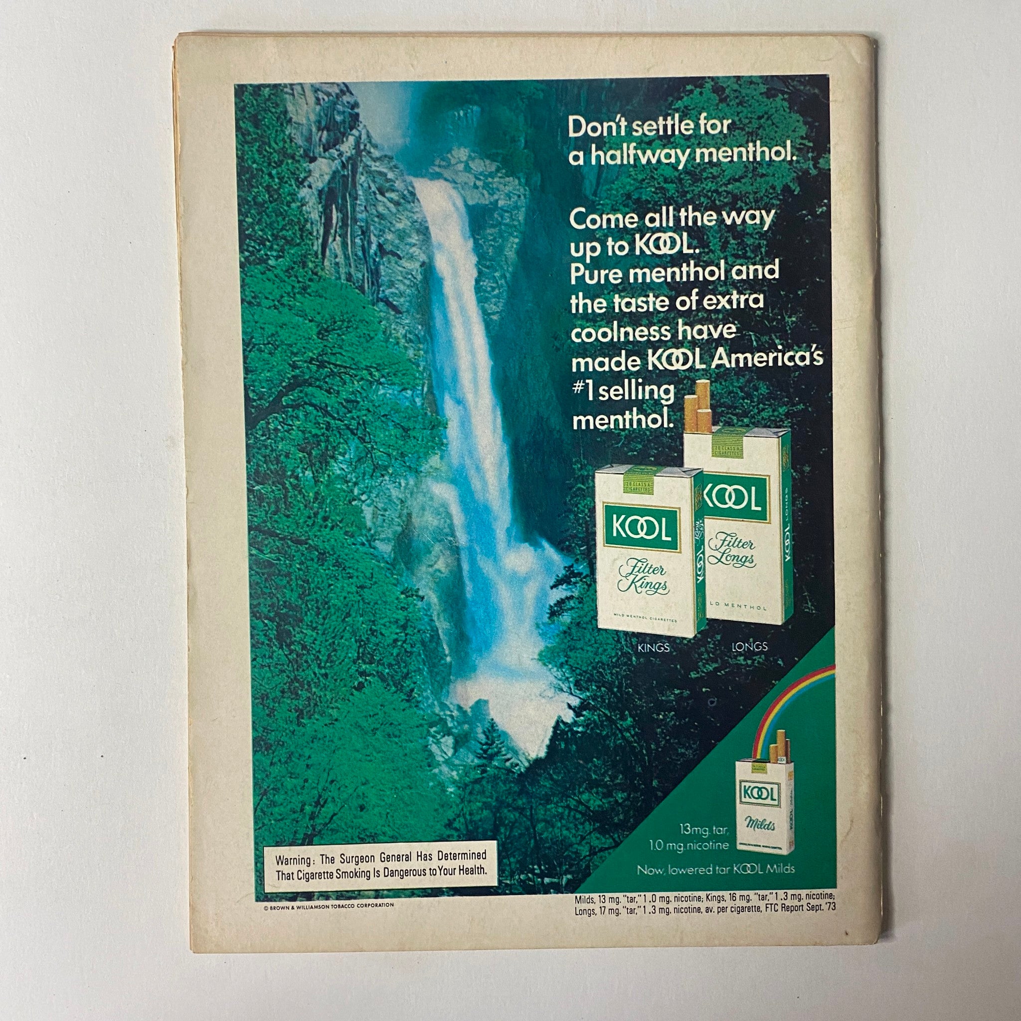 Back cover of The Ring Magazine July 1974 featuring an advertisement for Kool menthol cigarettes, emphasizing the product's refreshing appeal and the scenic beauty of nature.