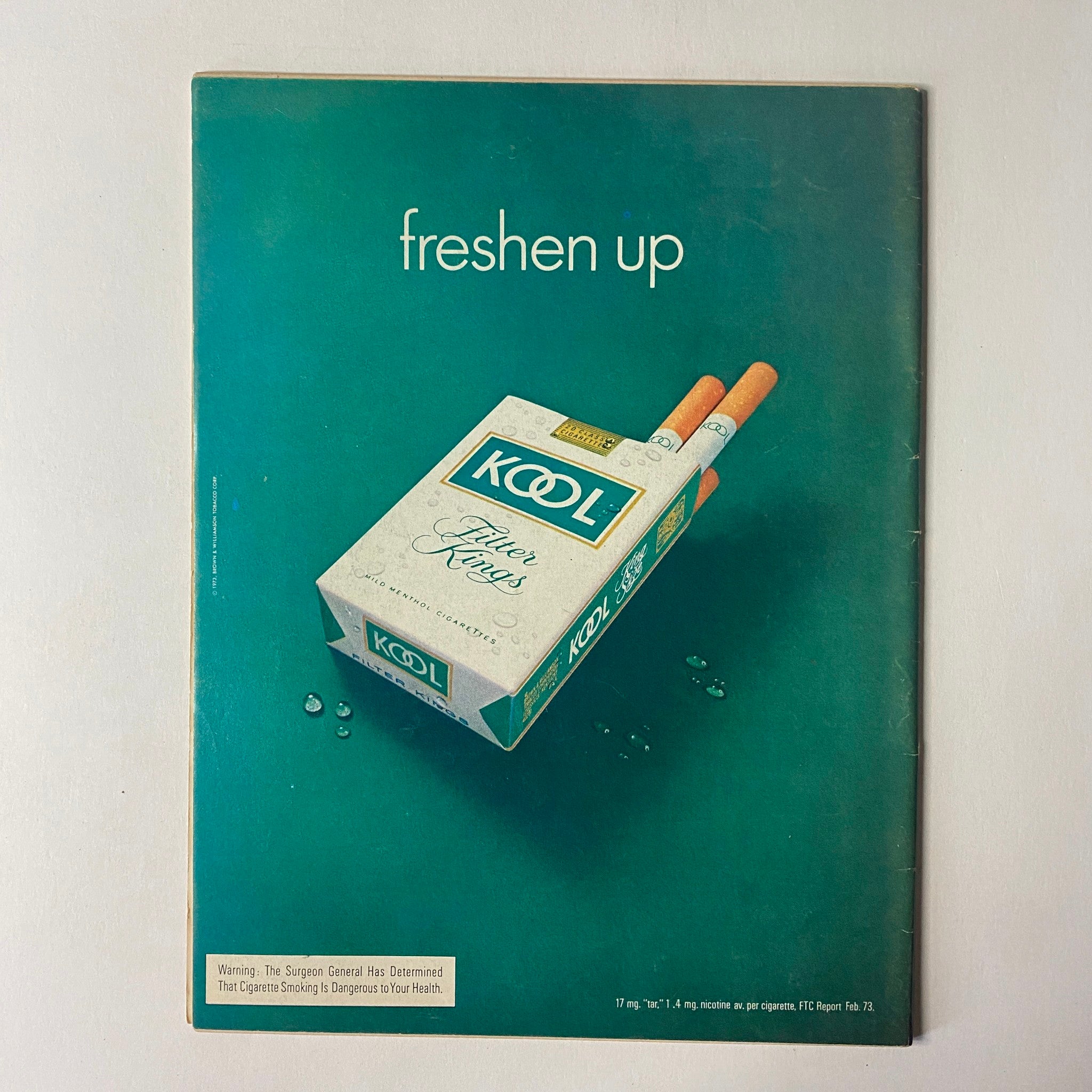 Back cover of The Ring Magazine August 1973, featuring an advertisement for Kool cigarettes with the slogan 'freshen up'.