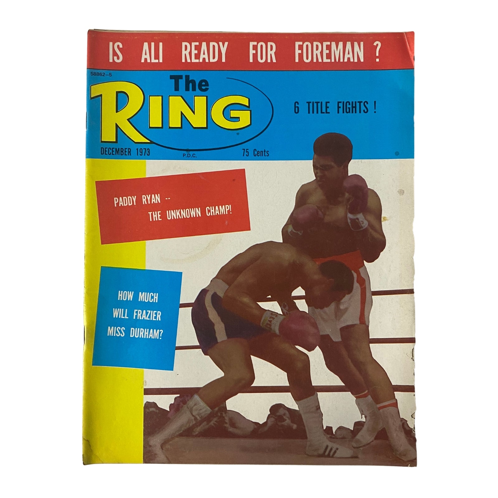 Cover of The Ring Magazine from December 1973 titled 'IS ALI READY FOR FOREMAN ?', featuring a boxing match with highlights about Paddy Ryan and Joe Frazier.