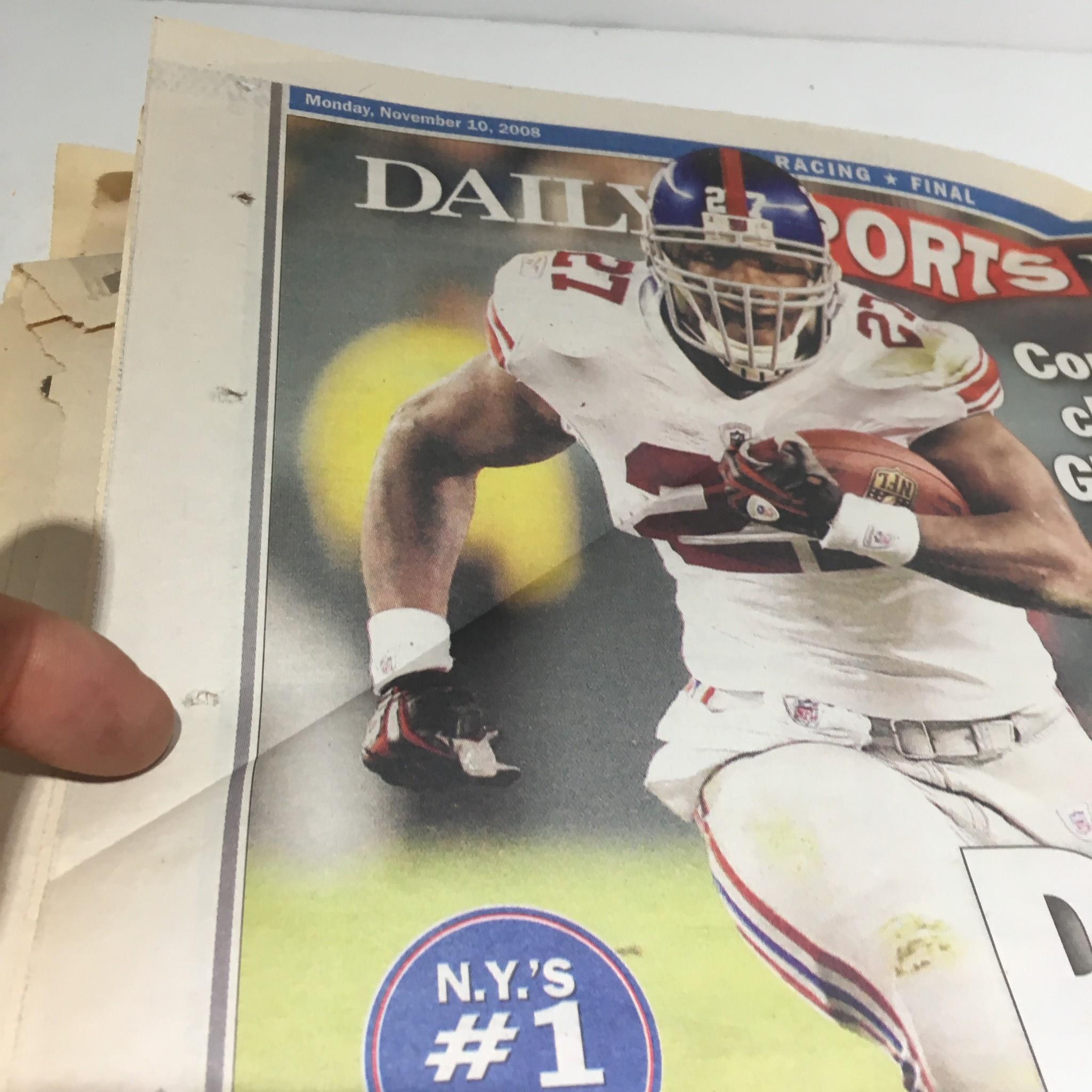 Front page of NY Daily Sports News from Nov 10, 2008, featuring a highlight of a player from the New York Giants with a focus on their impressive game against the Eagles.