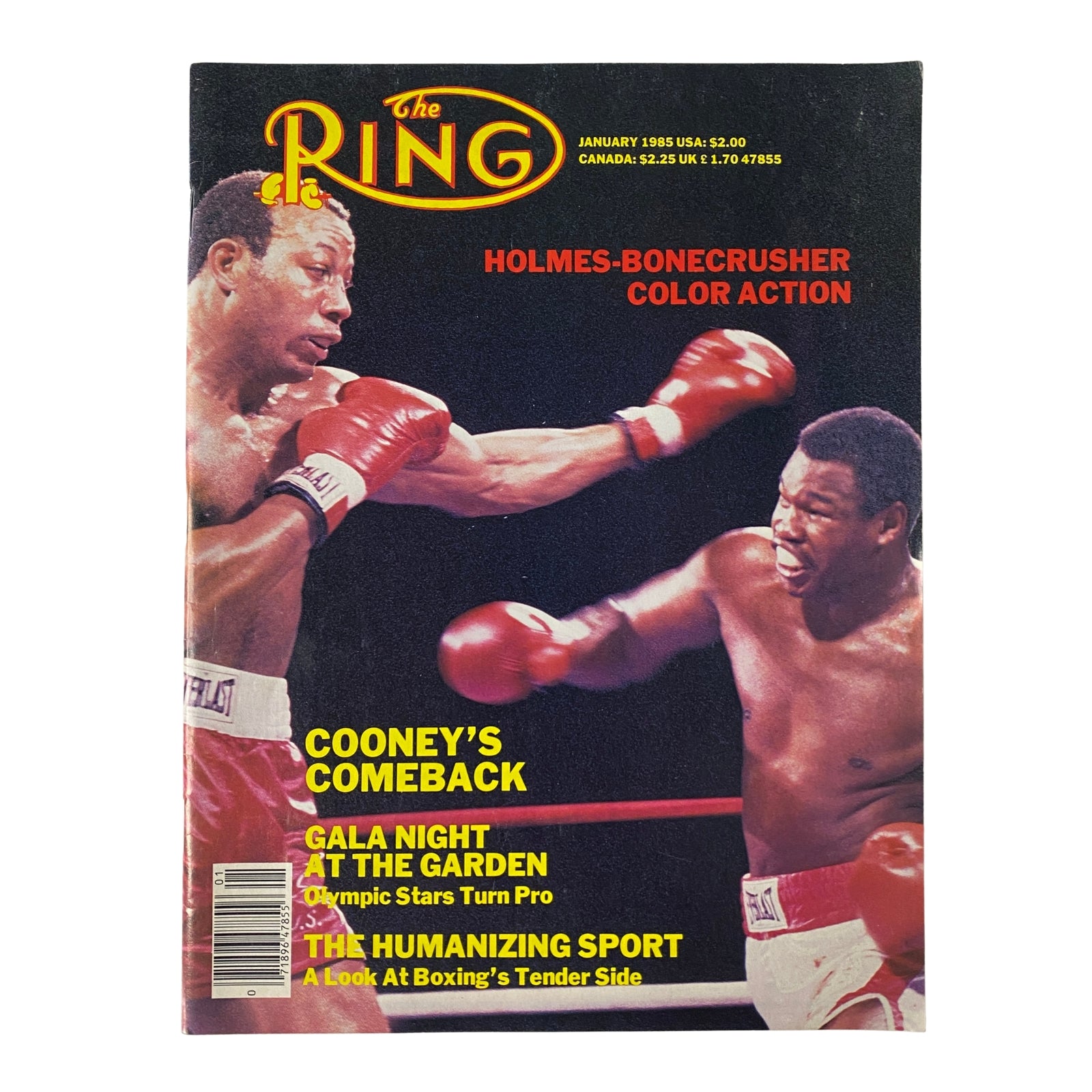 The Ring Magazine January 1985 cover featuring Larry Holmes and James 'Bonecrusher' Smith in a boxing match, labeled 'Holmes-Bonecrusher Color Action'. This issue discusses Cooney’s comeback and highlights important boxing events.