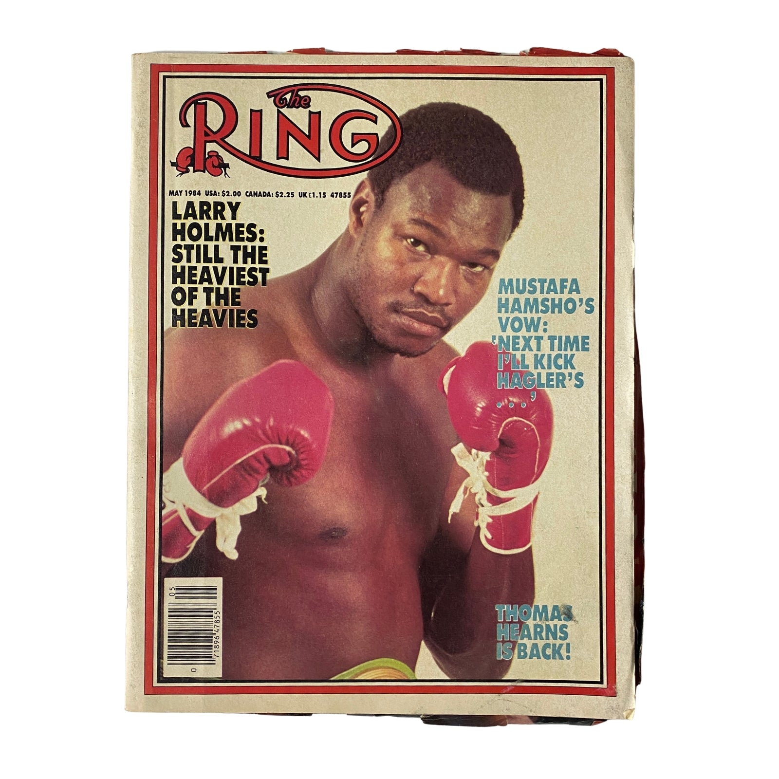 The Ring Magazine cover from May 1984 featuring heavyweight champion Larry Holmes, with the headline 'Larry Holmes: Still the Heaviest of the Heavies', showcasing Holmes in boxing gloves ready for action.