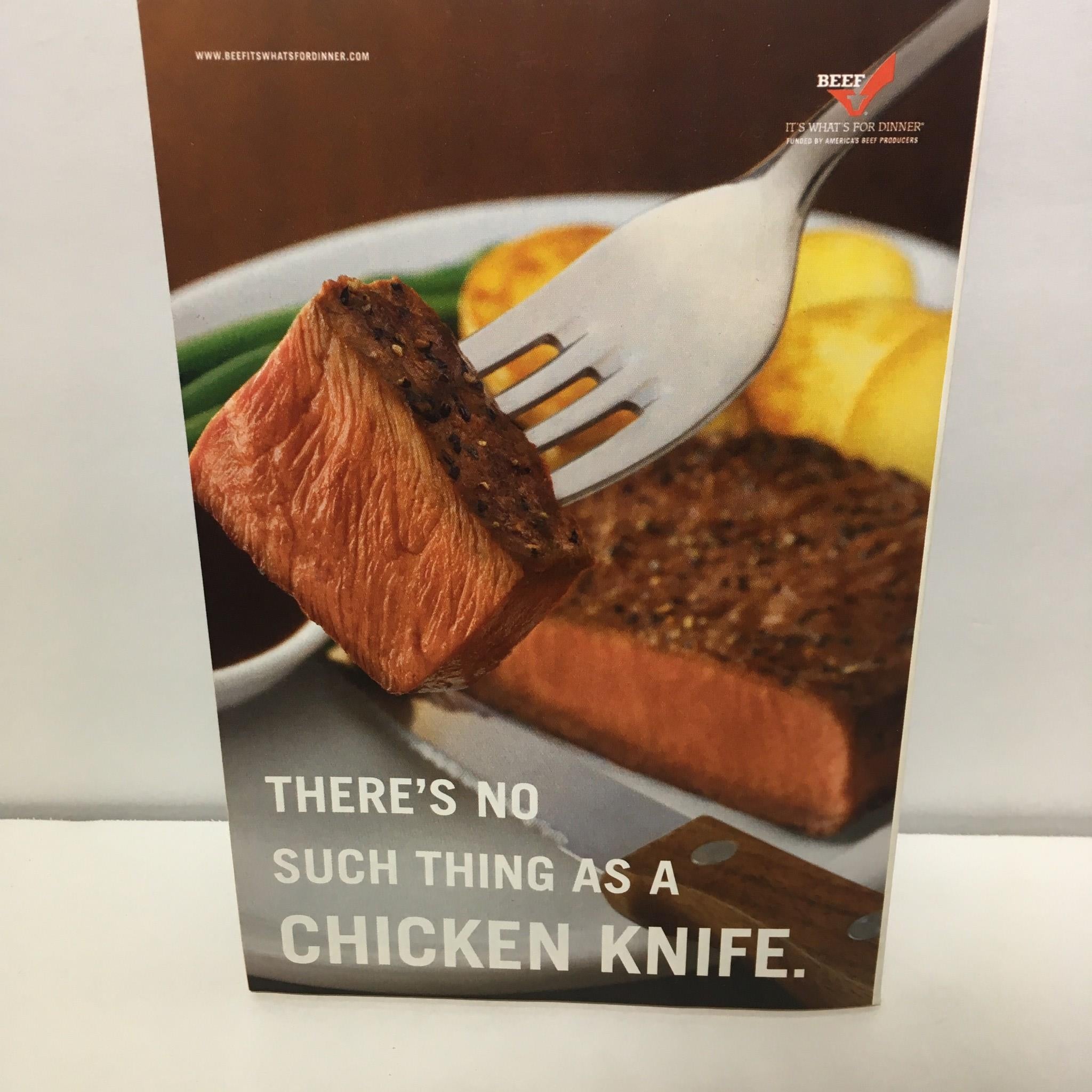 Beef advertisement featuring a fork holding a perfectly cooked piece of steak accompanied by golden potatoes, illustrating the tagline 'There's no such thing as a chicken knife.' TV Guide April 17-23 2005 Star Trek Ultimate Tribute Cover 1 of 3.