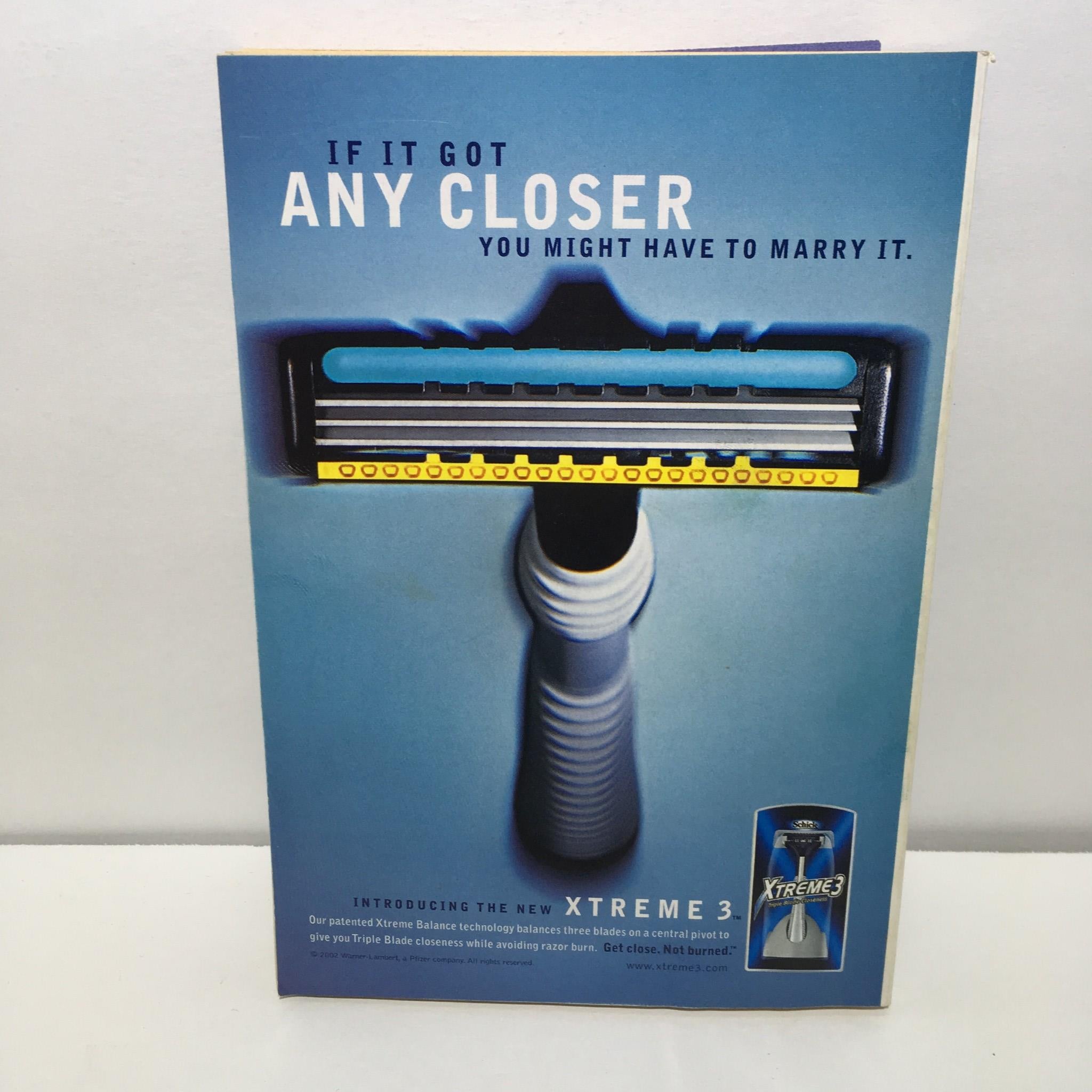 Promotional ad in TV Guide magazine featuring a razor with the tagline about extreme closeness. Part of the April 27-May 3, 2002 issue featuring Spider-Man.