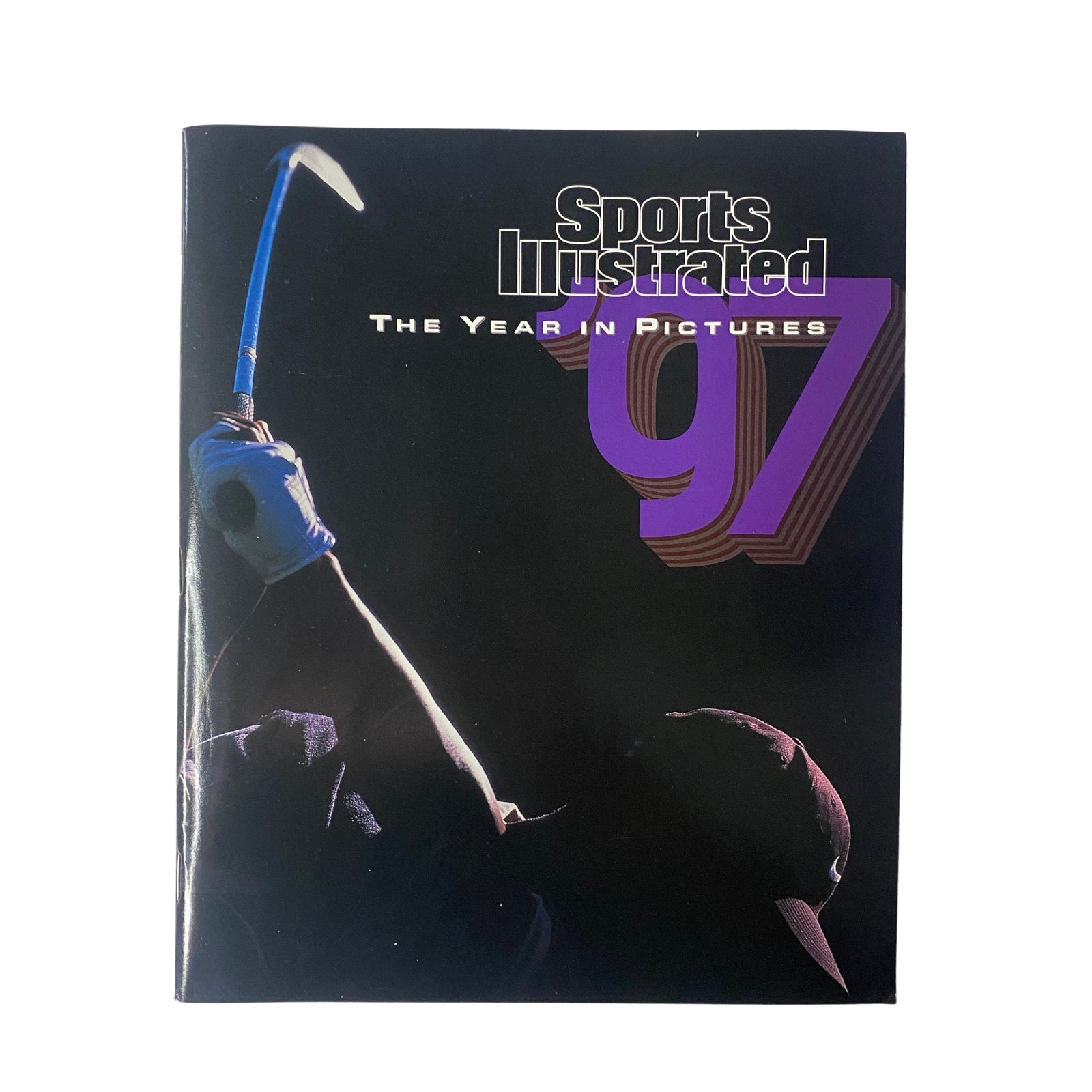 Cover of Sports Illustrated Magazine - Tiger Woods YEAR IN PICTURES 1997, featuring a silhouette of a golfer preparing to swing, representing the iconic moments in sports for that year.