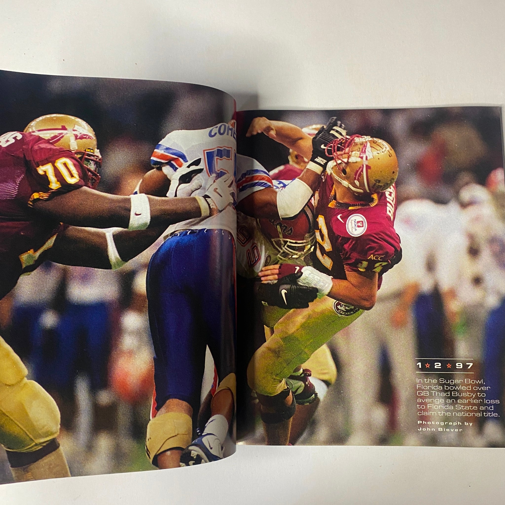 Inside page of Sports Illustrated Magazine - Tiger Woods YEAR IN PICTURES 1997, showcasing a significant moment from the Super Bowl, featuring two football players in action, capturing the intensity of the game.