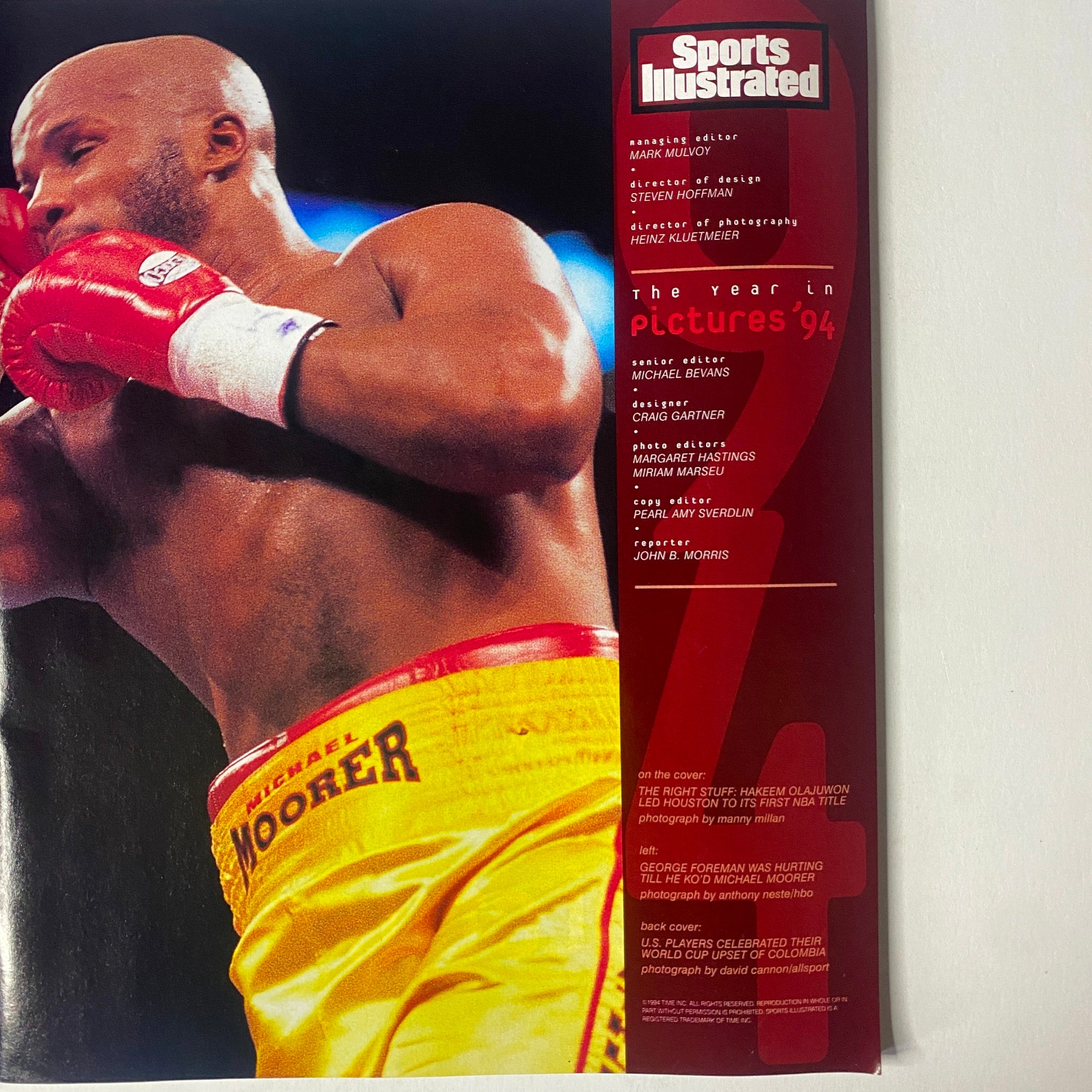 Cover of Sports Illustrated magazine 1994 Year in Pictures featuring a boxing match with Michael Moorer, showcasing the sporting highlights of the year.