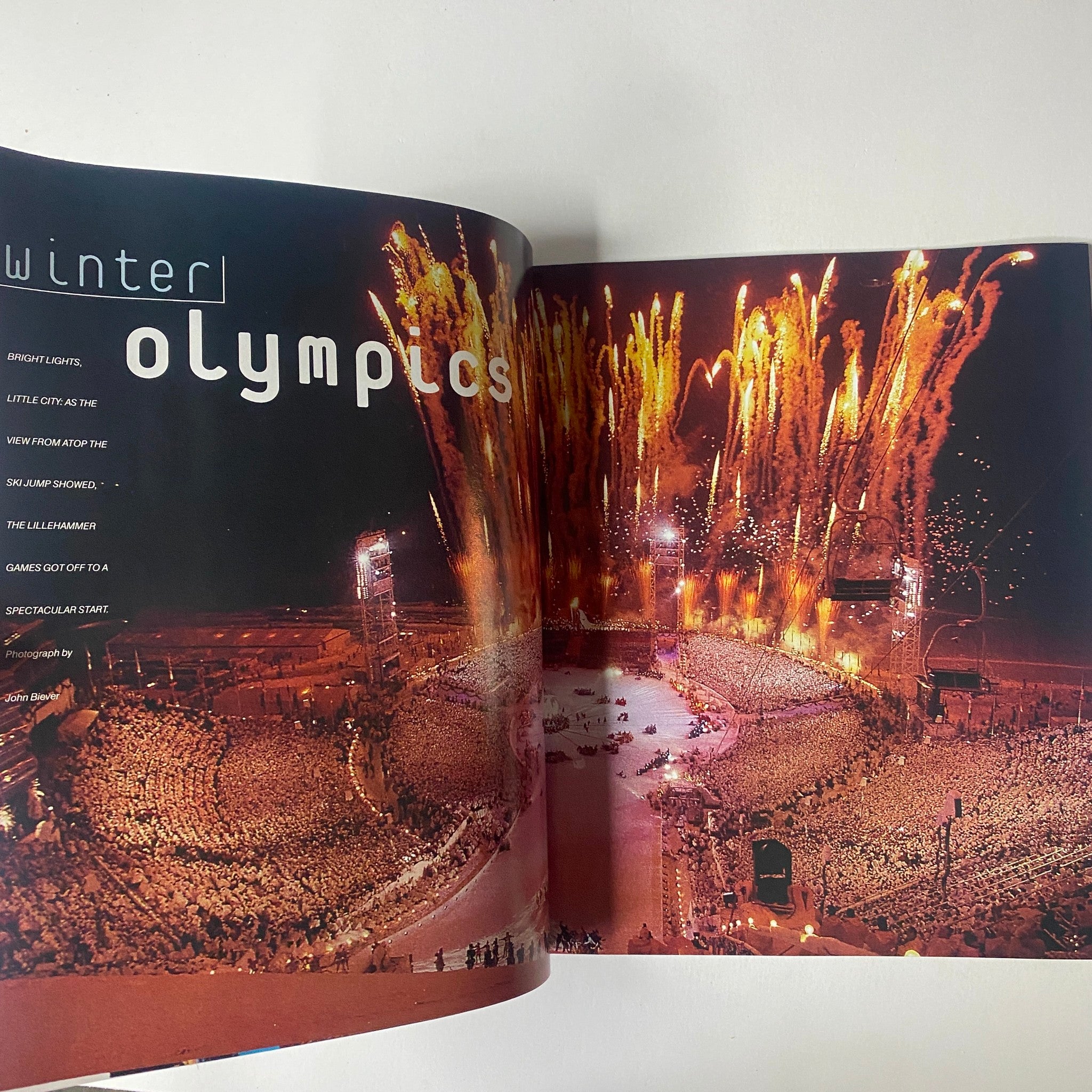 Inside spread of Sports Illustrated magazine 1994 Year in Pictures, featuring a spectacular fireworks display from the Winter Olympics, celebrating winter sports.