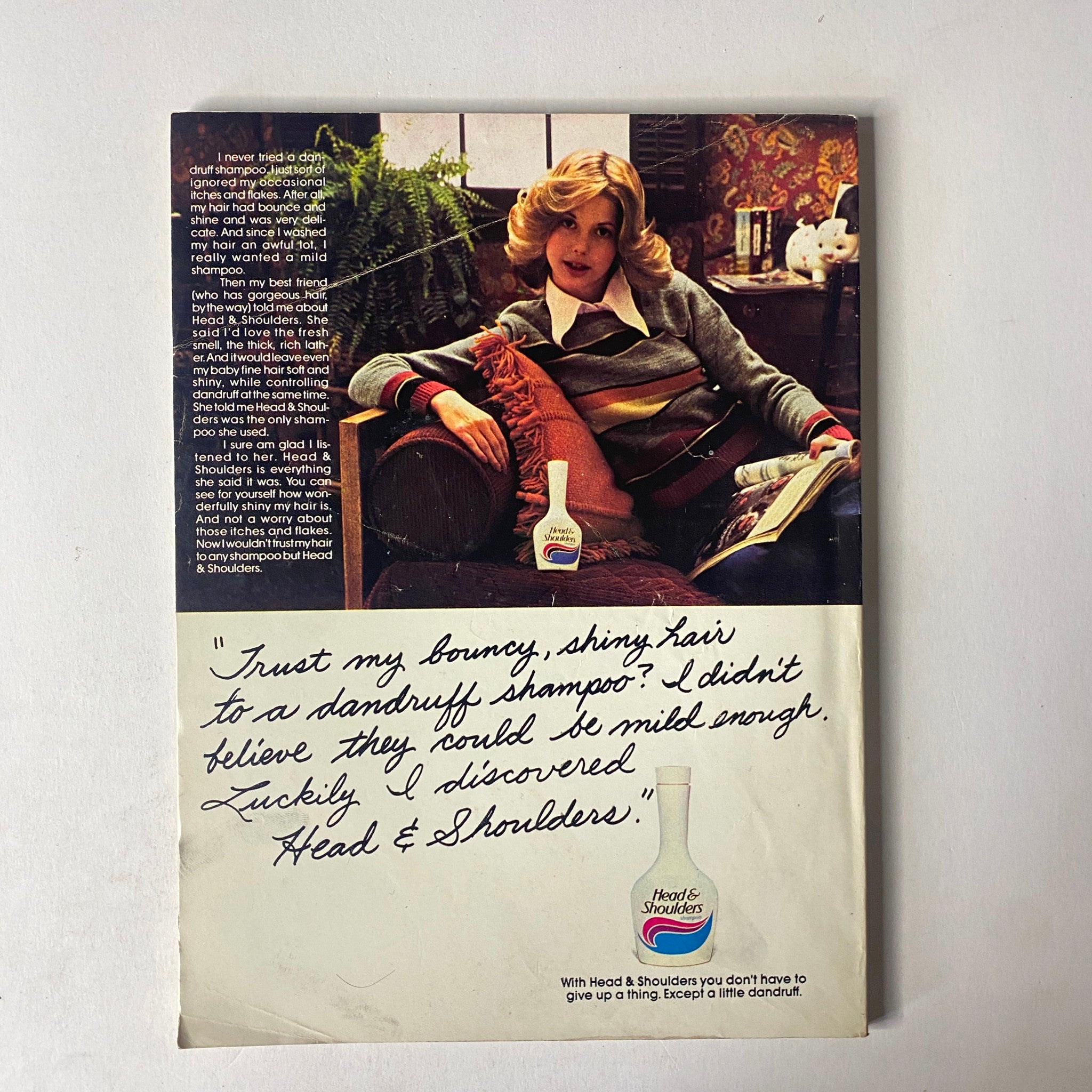 Back cover of Seventeen Magazine October 1977 Super Beauty Issue displaying an advertisement for Head & Shoulders shampoo, promoting shiny hair.