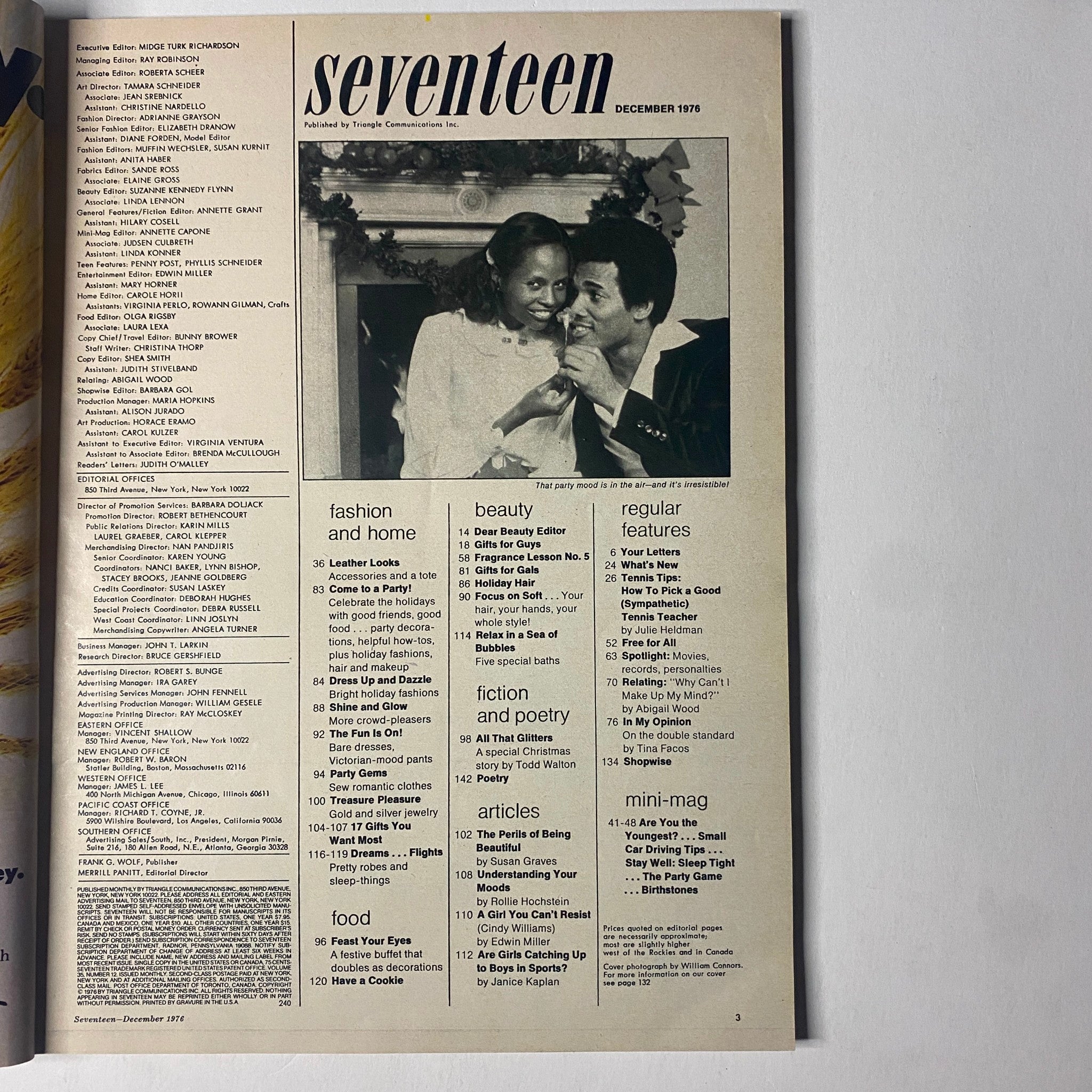 Seventeen Magazine December 1976 featuring a cozy holiday atmosphere with a couple posing next to a Christmas tree, highlighting the spirit of the season with festive images and advice, and showcasing article, 'How To Pick a Good Tennis Teacher.'