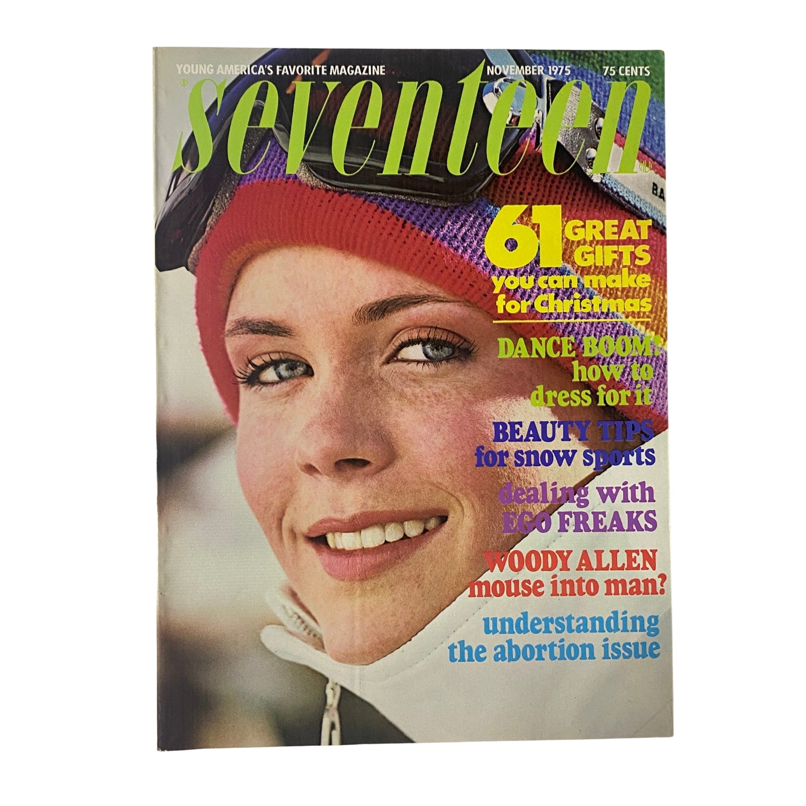 Seventeen Magazine November 1975 cover featuring a smiling girl wearing ski gear, headline highlights including '61 Great Gifts for Christmas,' 'Woody Allen mouse into man?', and 'Dance Boom.' This vintage magazine showcases a mix of seasonal topics and cultural insights.