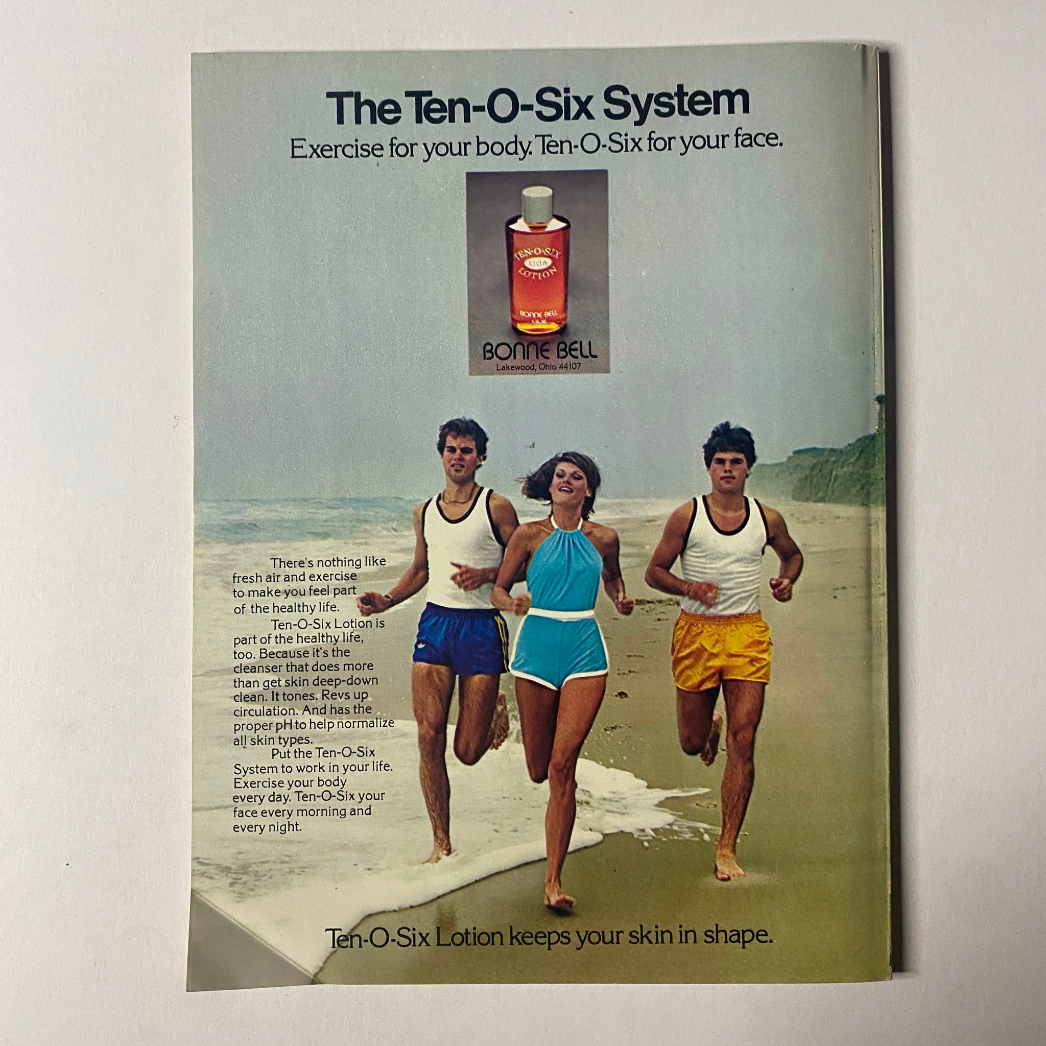 Advertisement from Seventeen Magazine January 1977 for Ten-O-Six System lotion with a group of young adults exercising on the beach.