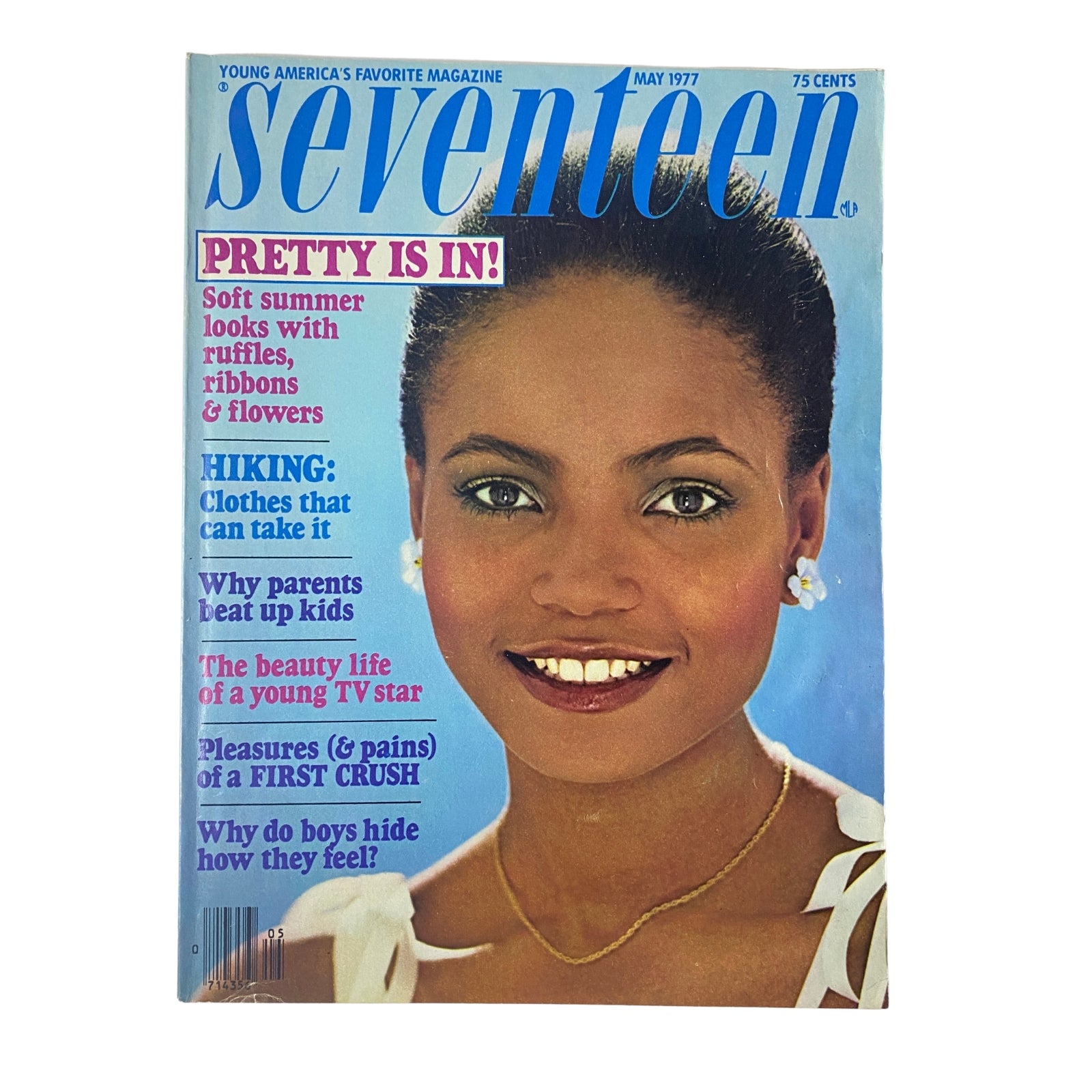 Seventeen Magazine May 1977 cover featuring a woman with earrings, highlighting articles on summer fashion and hiking, with the title 'Pretty Is In'.