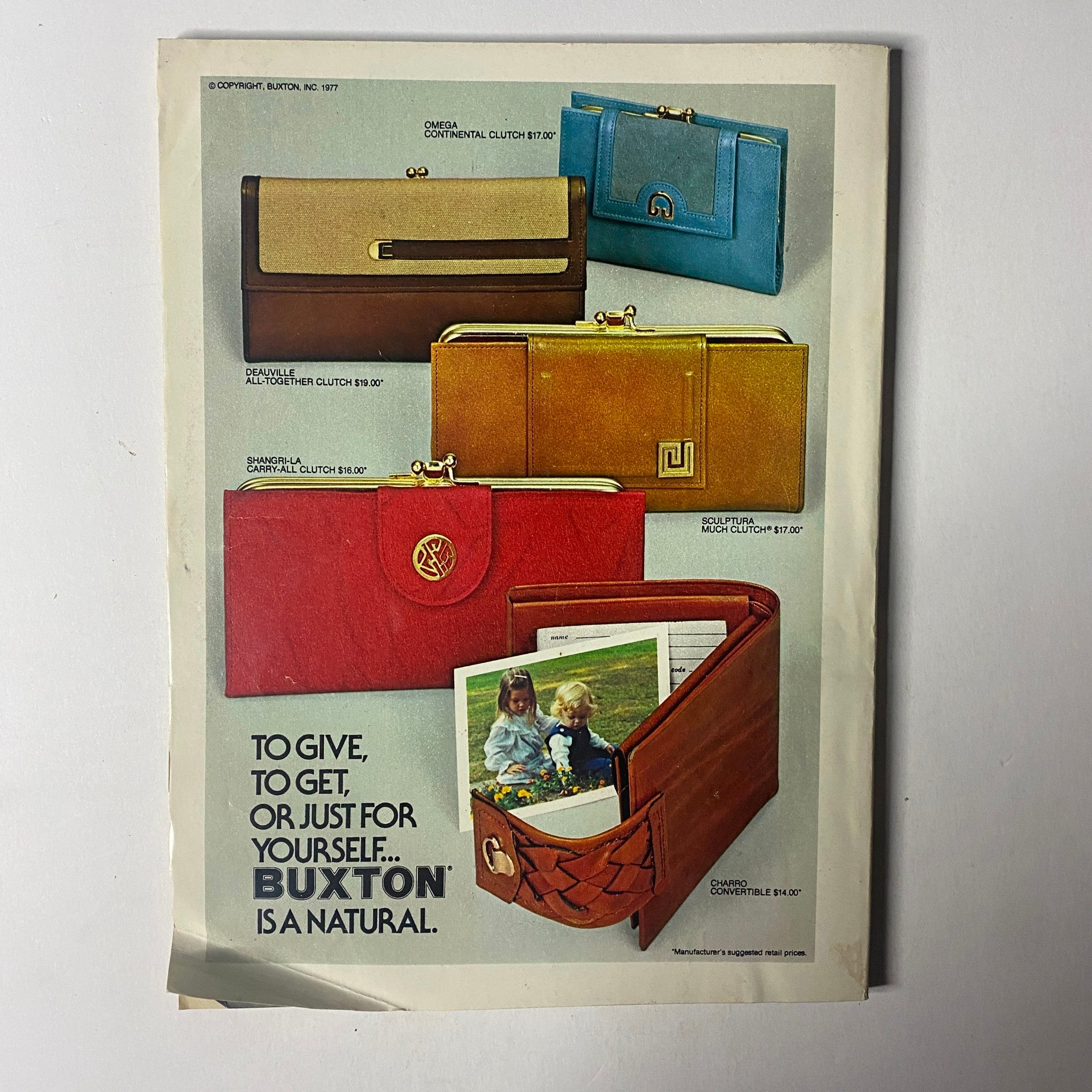 Advertisement in Seventeen Magazine May 1977 displaying various stylish wallets from Buxton, emphasizing gifts for oneself or others.