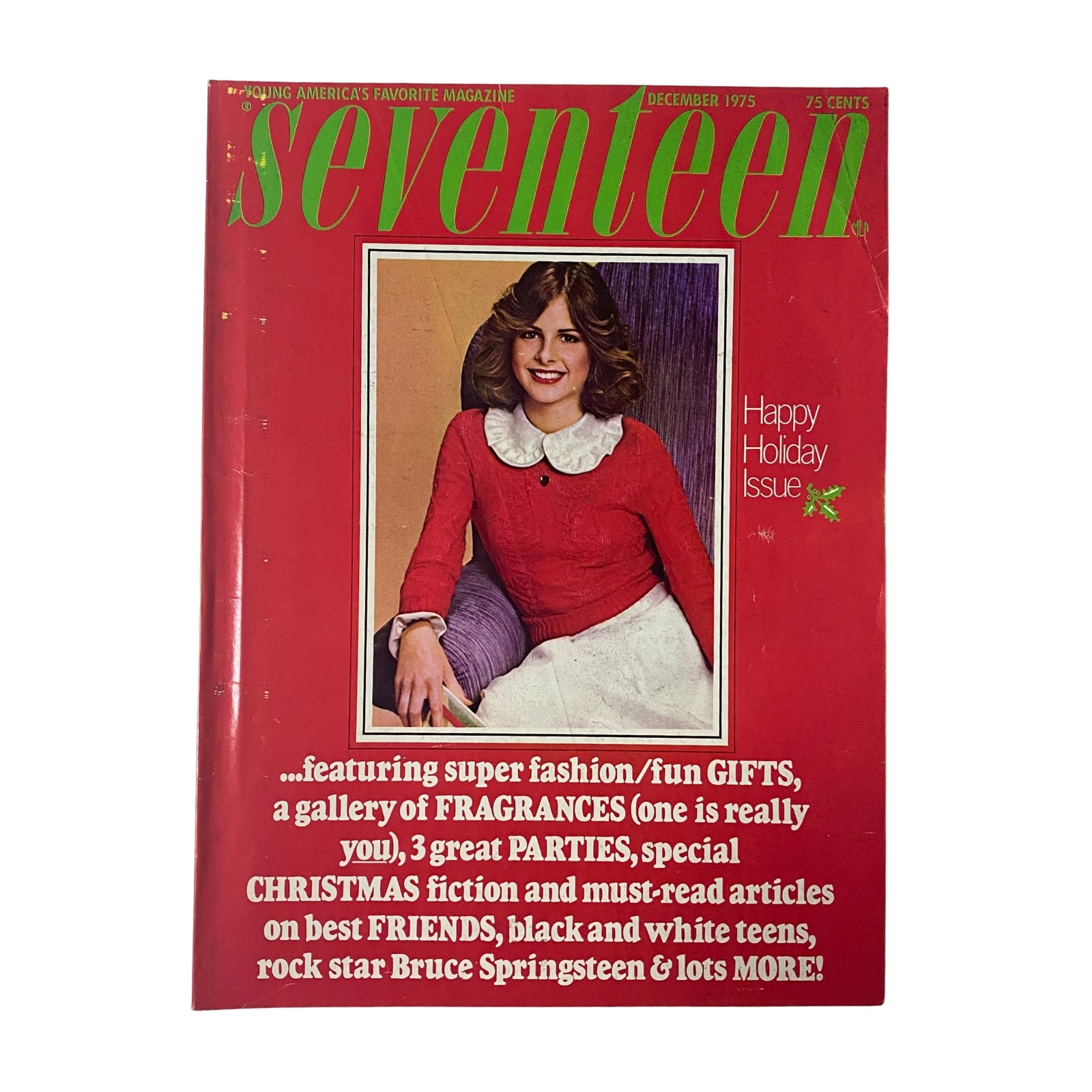 Cover of Seventeen Magazine December 1975 Happy Holiday Issue, featuring a young woman in a red dress, promotional text highlighting festive gifts, fashion, fragrances, and Bruce Springsteen.