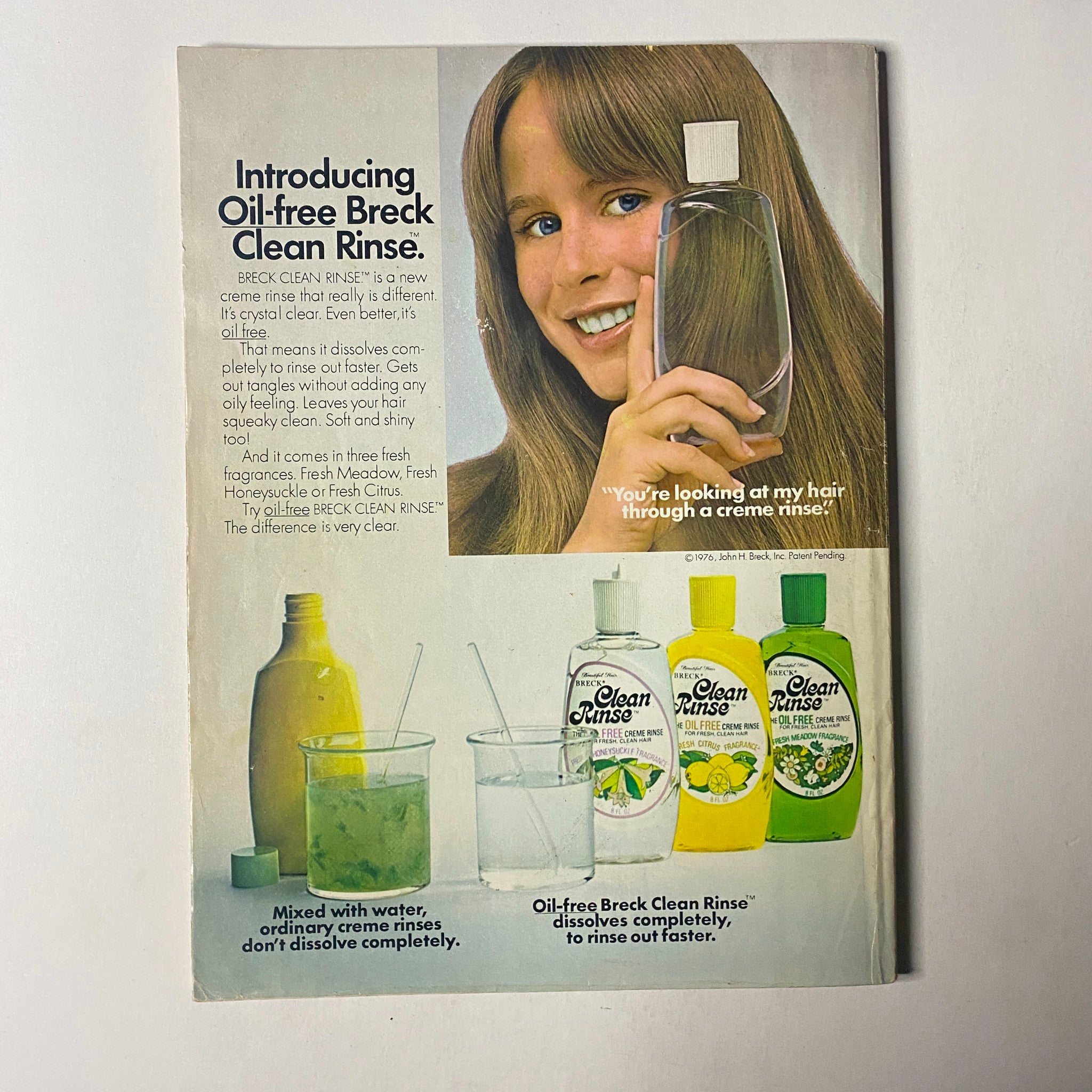 Ad from Seventeen Magazine July 1976 introducing Oil-free Breck Clean Rinse, highlighting its benefits for healthy hair.