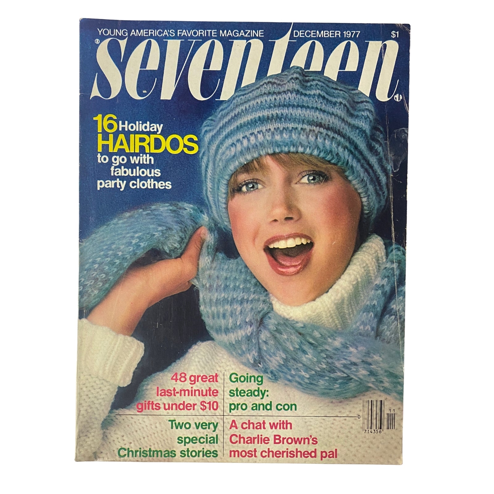 Seventeen Magazine December 1977 cover featuring a cheerful model in a winter hat and scarf, illustrating holiday hairstyles and festive fashion tips. This issue includes a special feature on Charlie Brown and popular New Year’s wishes.