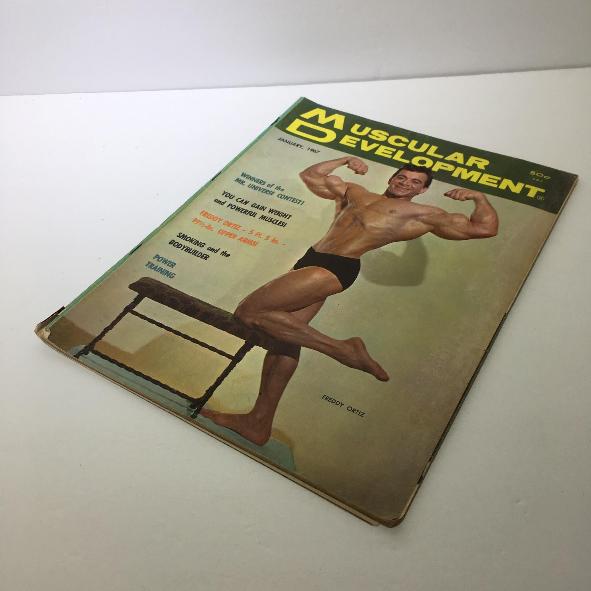 Angle view of Muscular Development Magazine featuring Freddy Ortiz from January 1967, displaying the cover and contents.