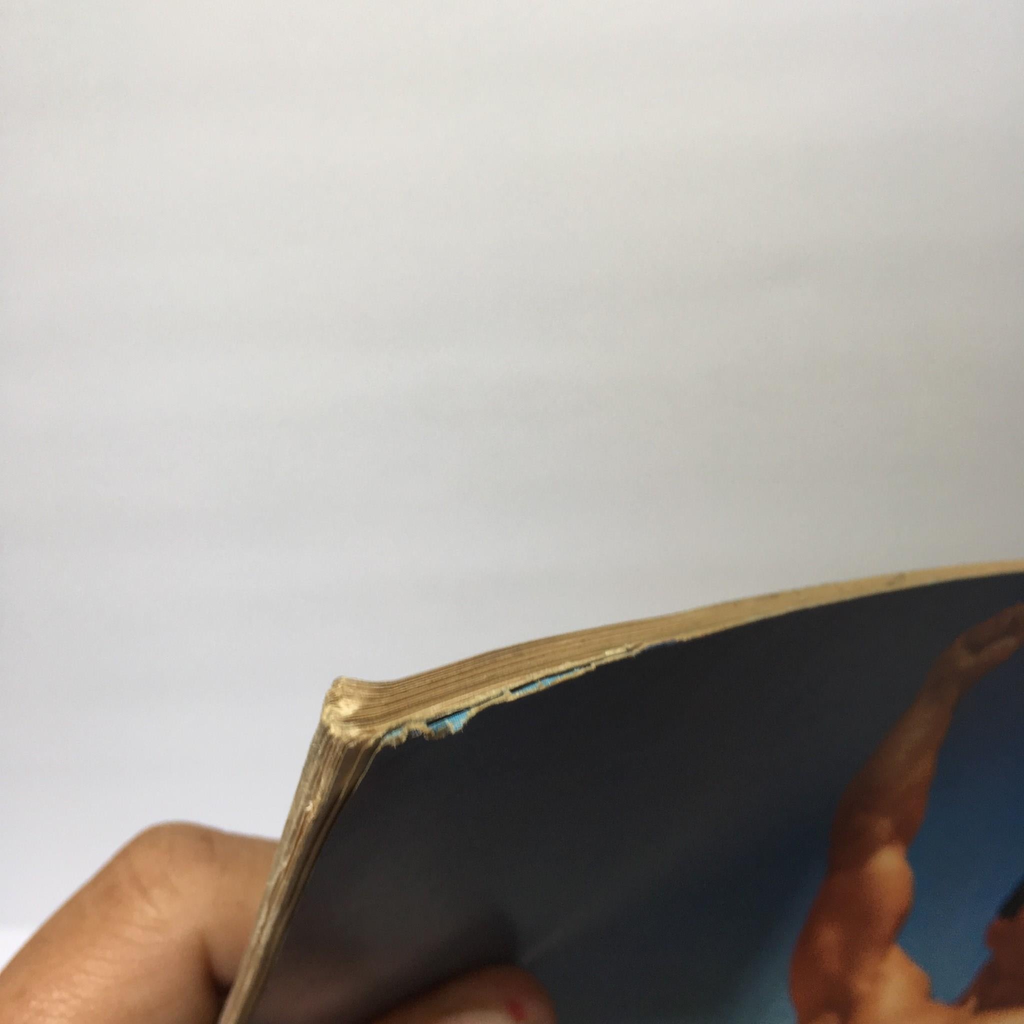 Close-up view of the edge of the Muscular Development Magazine June 1967, showcasing minor wear.