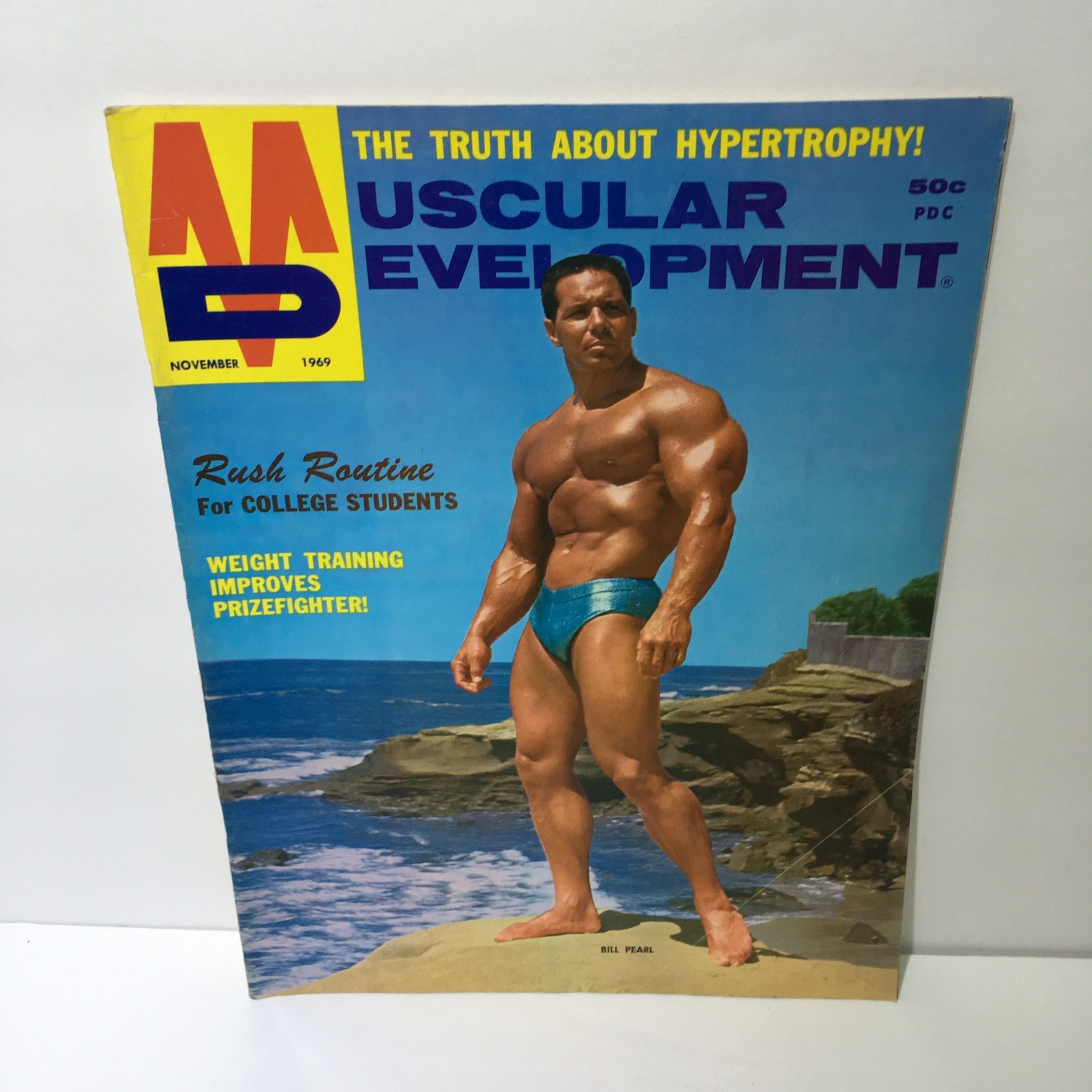 Cover of Muscular Development Magazine November 1969 featuring Bill Pearl with a muscular physique against a rocky background.