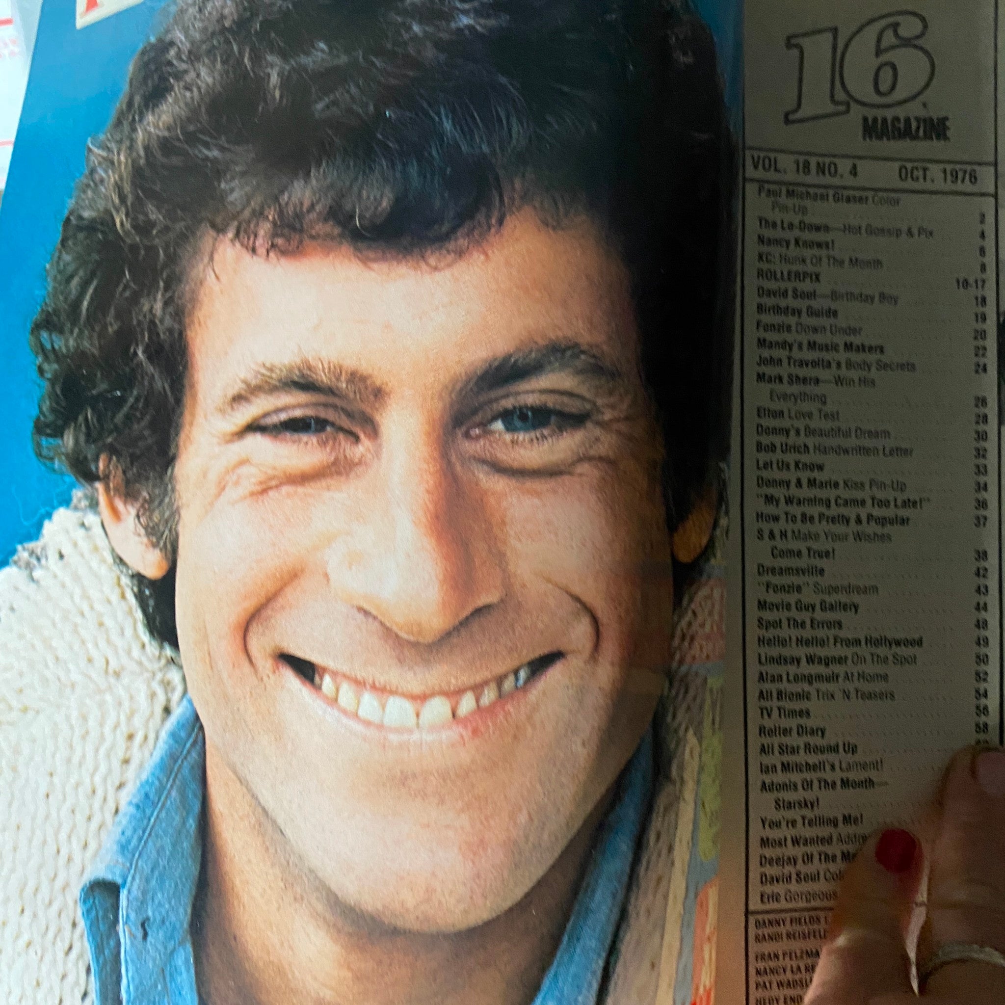 Close-up image of a smiling male celebrity from the VTG 16 Magazine October 1976, showcasing engaging content about popular stars from the era.