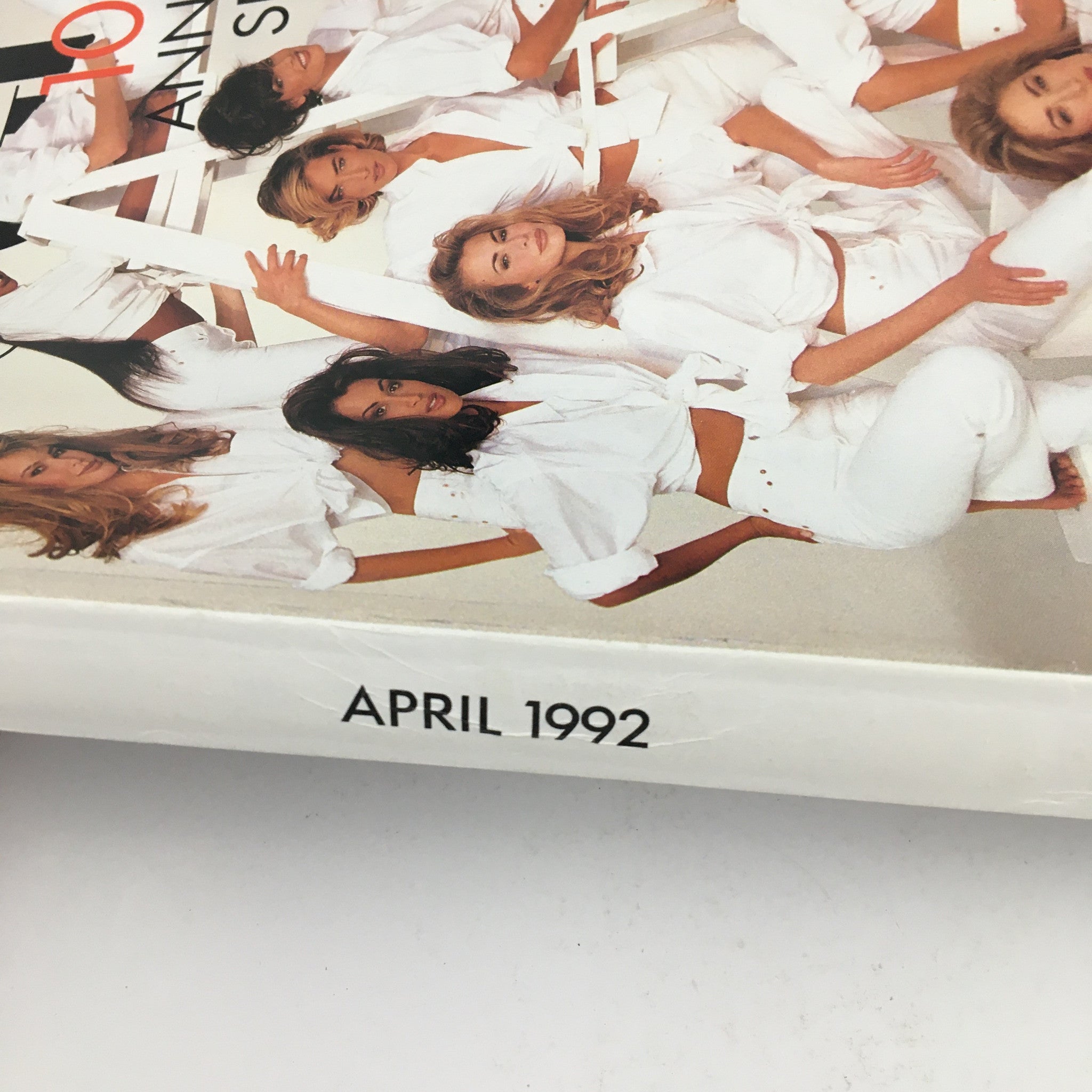 Close-up view of Vogue Magazine April 1992 Anniversary featuring supermodels Paulina Porizkova, Cindy Crawford, and others in stylish white outfits on the cover.