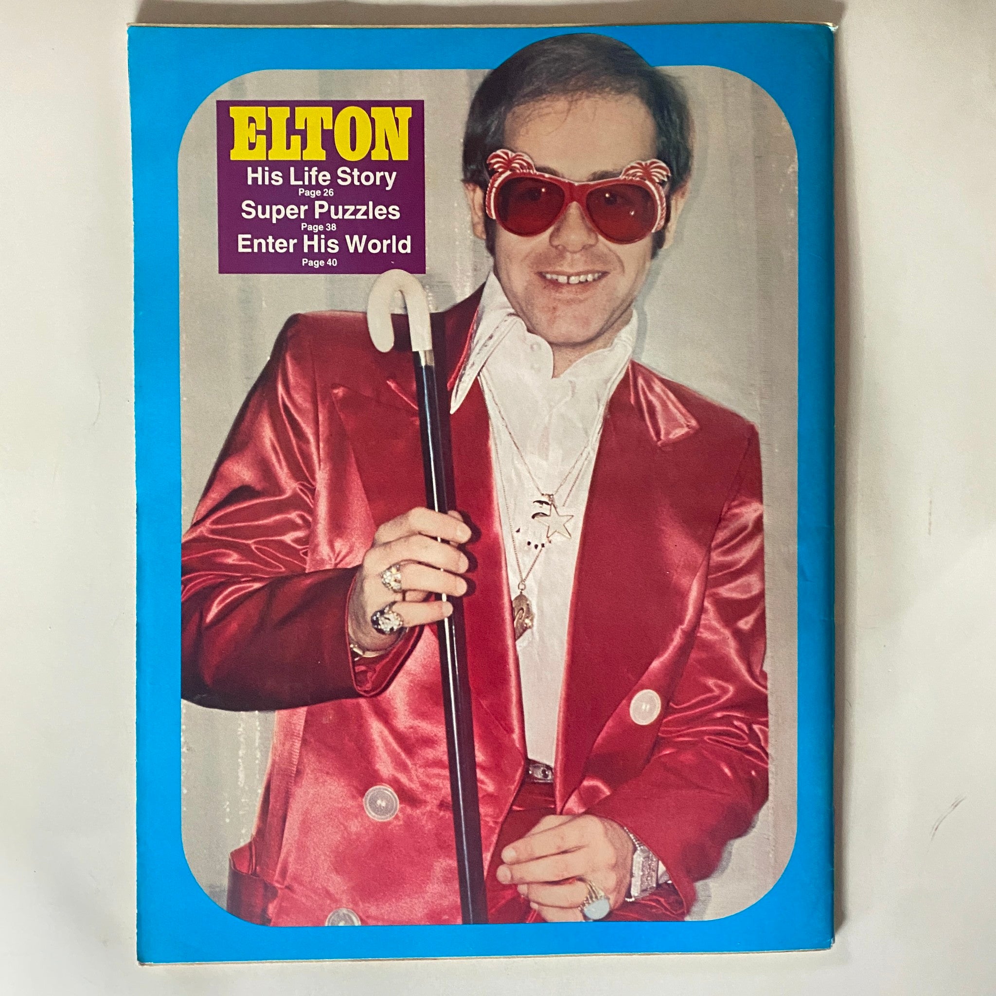 VTG 16 Magazine May 1976 featuring an iconic image of Elton John in a red suit and oversized sunglasses, showcasing a vintage pop culture collectible.