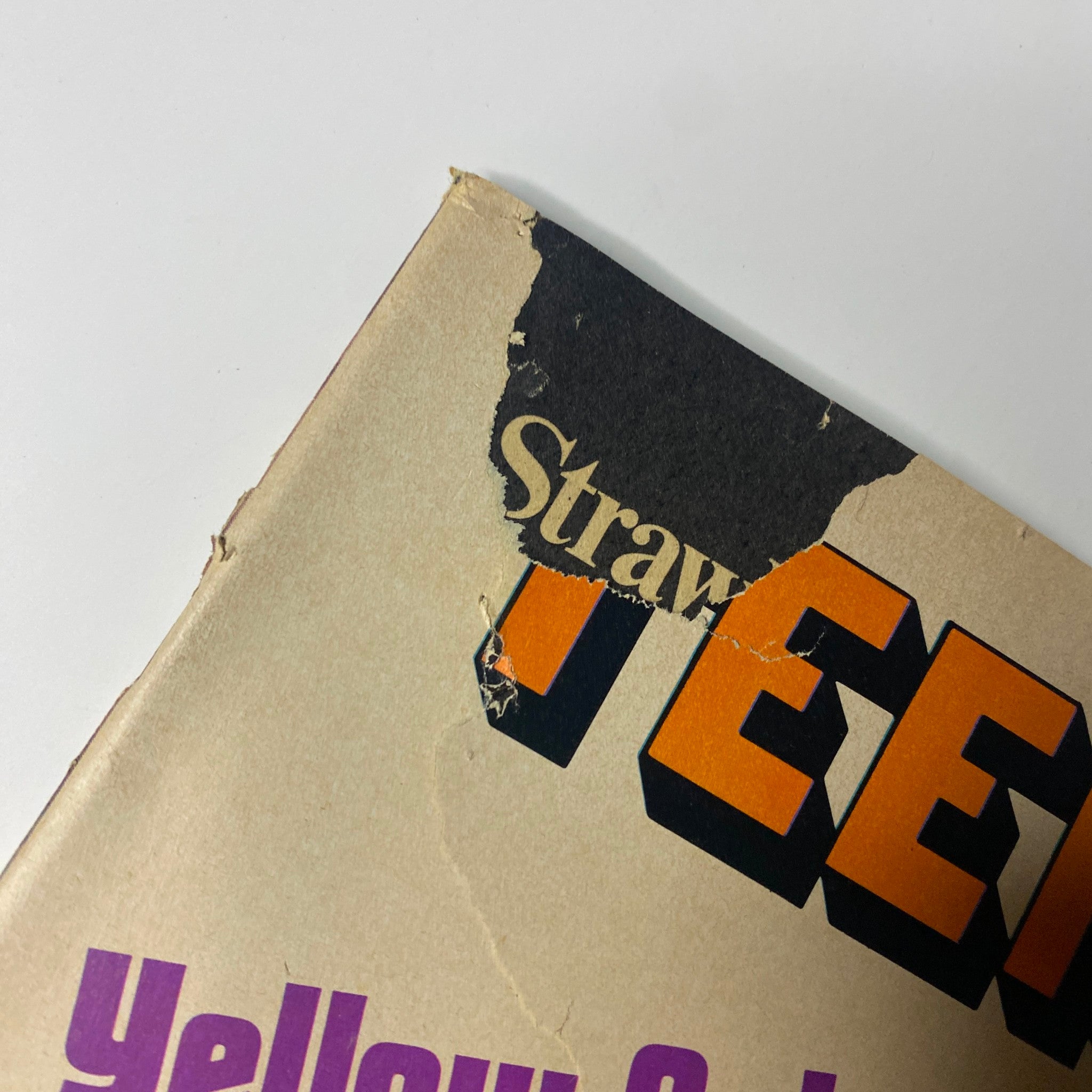 Close-up of the damaged corner of the Teen Set Magazine 1968 The Beatles Special cover, revealing wear and tear which indicates its vintage condition.