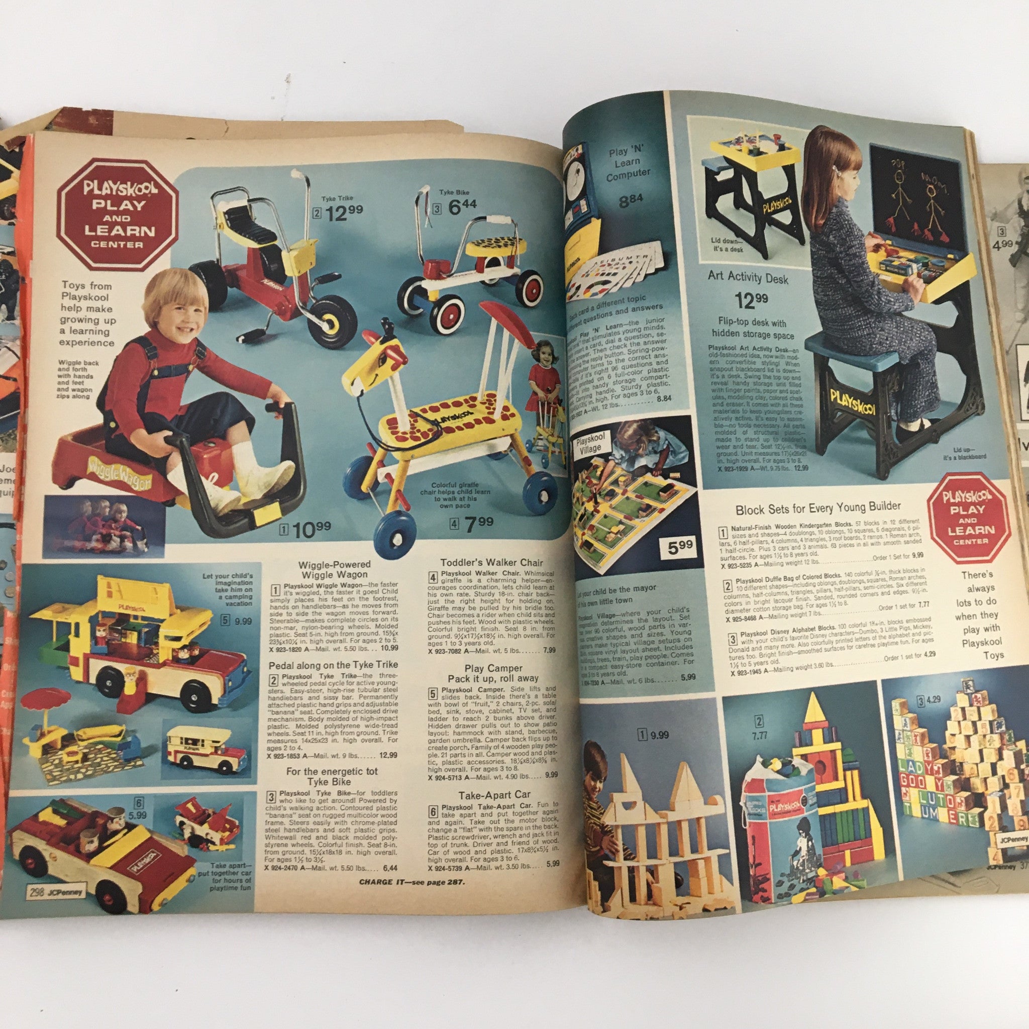 1972 JCPenney Christmas Toys and Giftwares Price Guide Catalog demonstrating PlaySchool play items including ride-on toys and activity desks for young children.