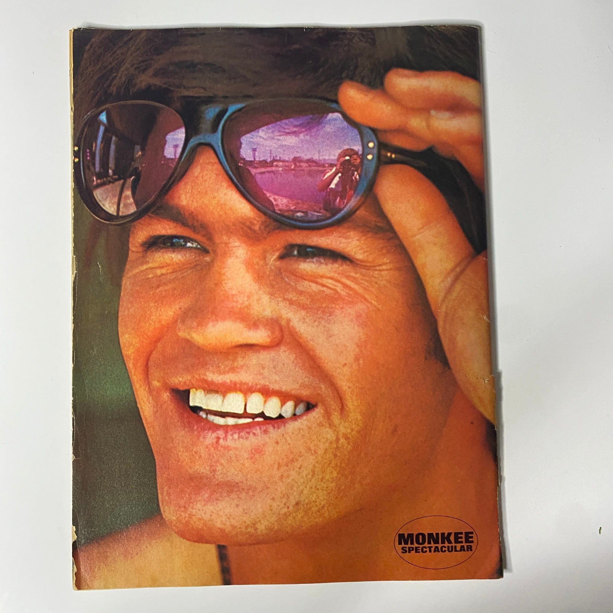 Cover of Tiger Beat's Official September 1967 #5 Monkee Spectacular featuring a smiling male figure wearing sunglasses with reflections, showcasing the joyful essence of Monkeemania, ideal for fans of vintage magazines and music memorabilia.